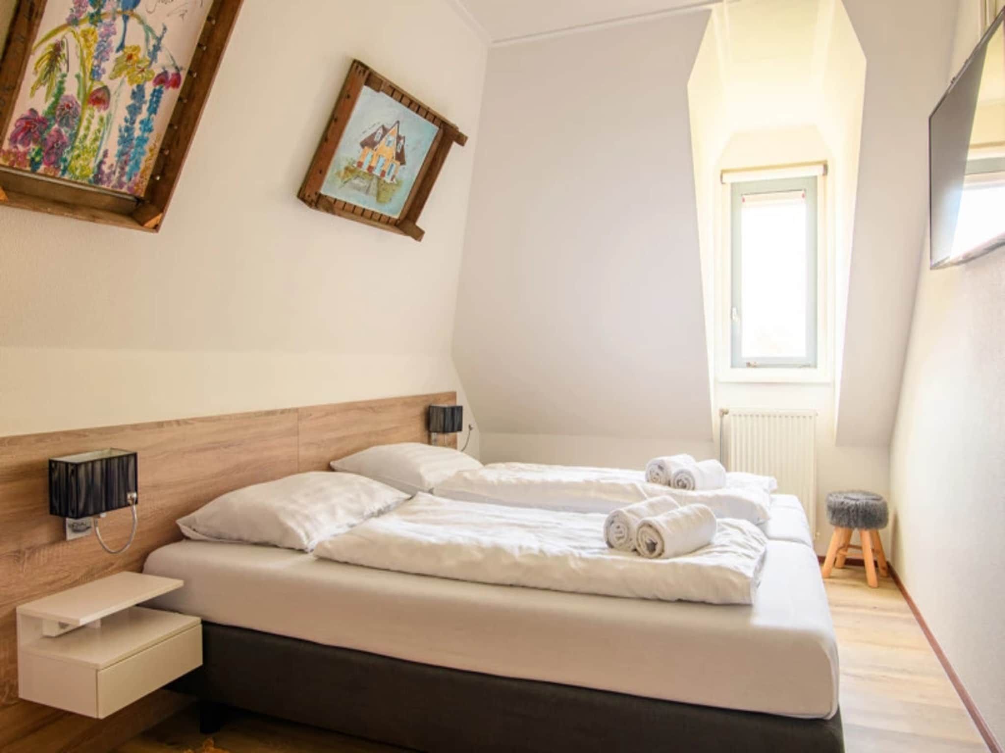 Een slaapkamer van Vakantiepark Duynzicht 3 in Julianadorp aan zee