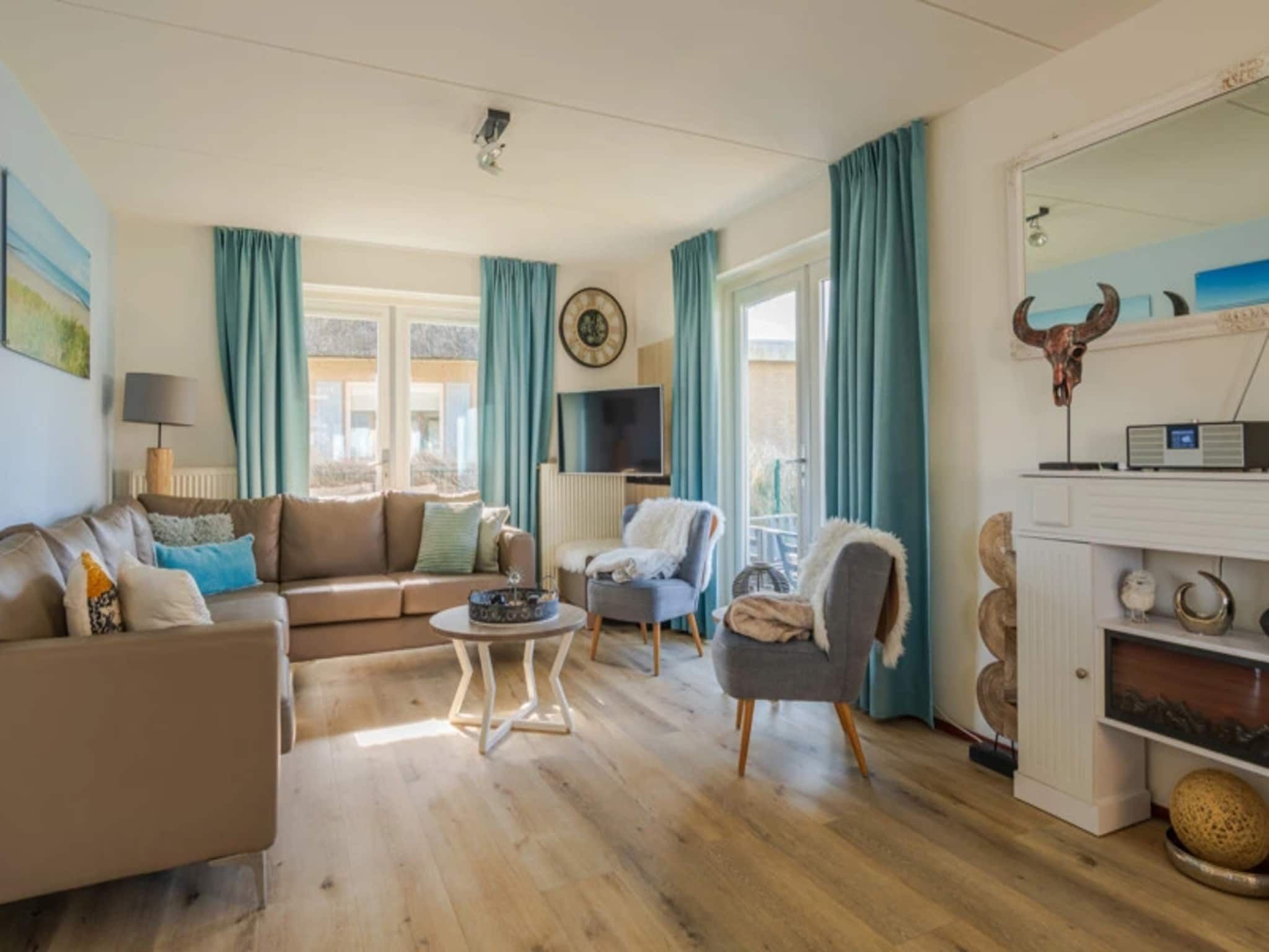 De woonkamer van Vakantiepark Duynzicht 3 in Julianadorp aan zee