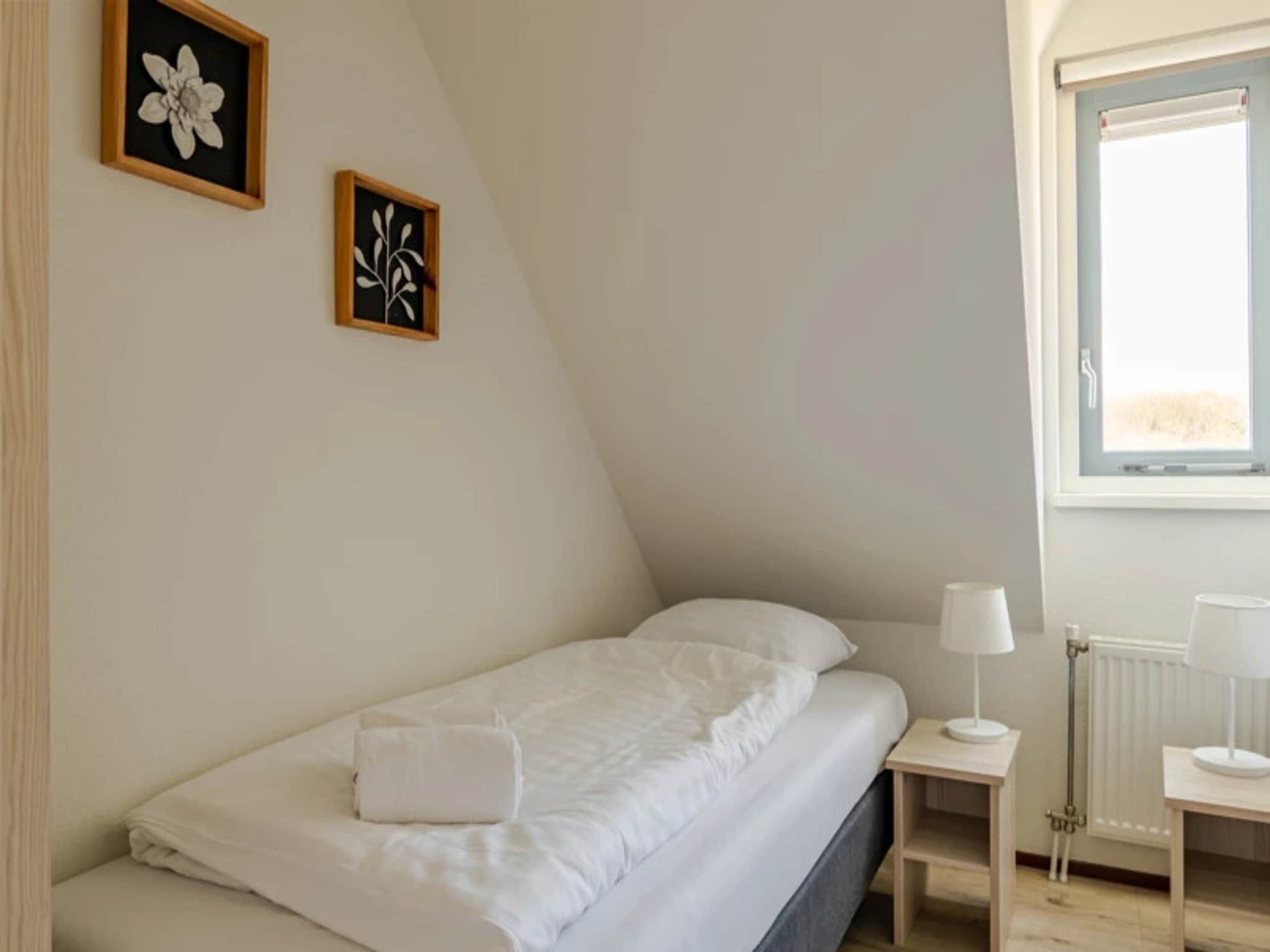 Een slaapkamer van Vakantiepark Duynzicht 3 in Julianadorp aan zee