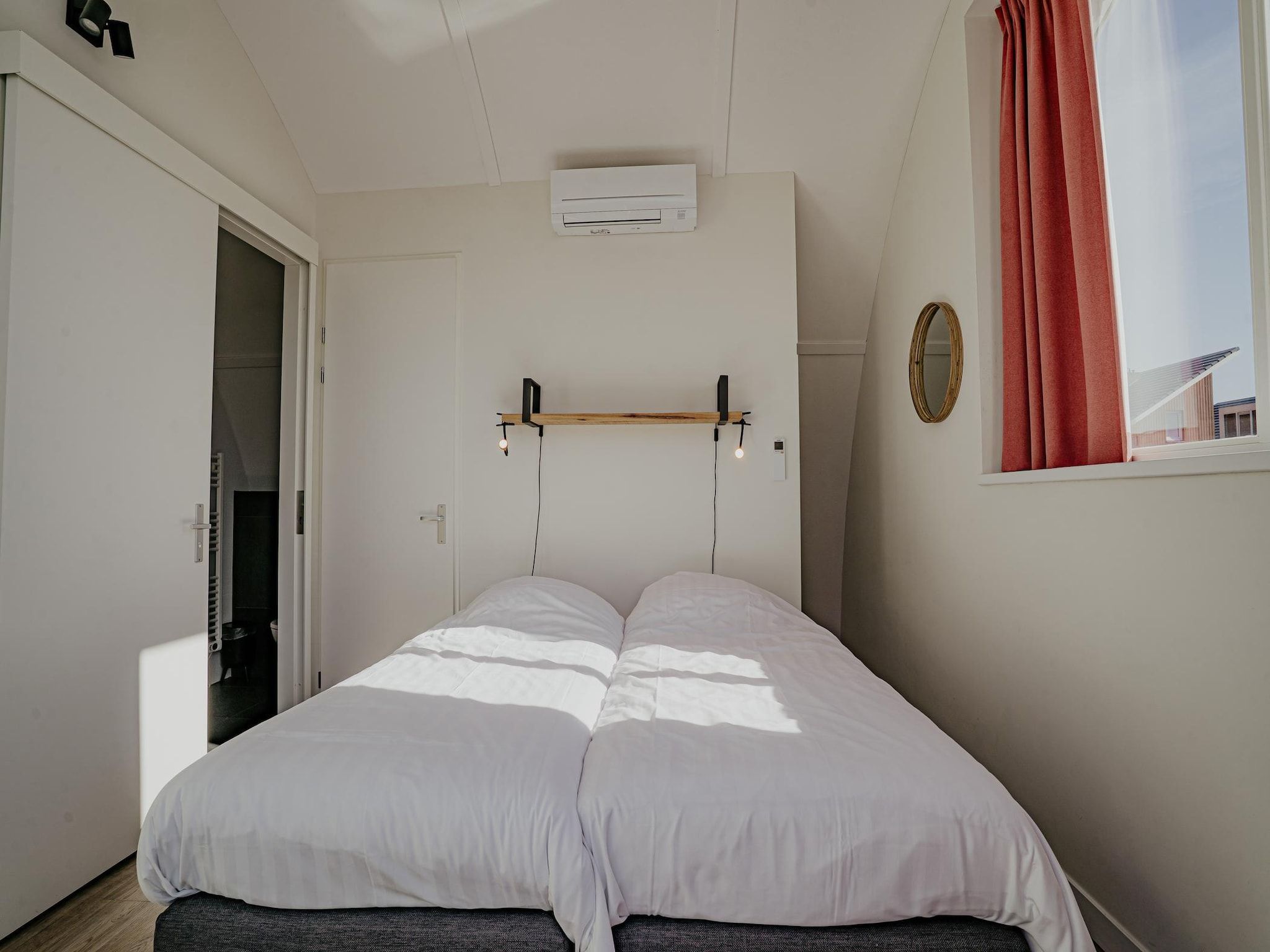 Een slaapkamer van Waterpark de Meerparel 14 in Uitgeest