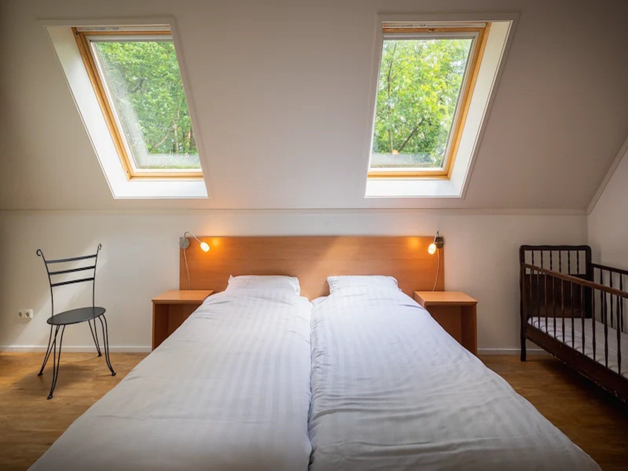 Een slaapkamer van Vakantiepark de Berkenhorst 15 in Kootwijk