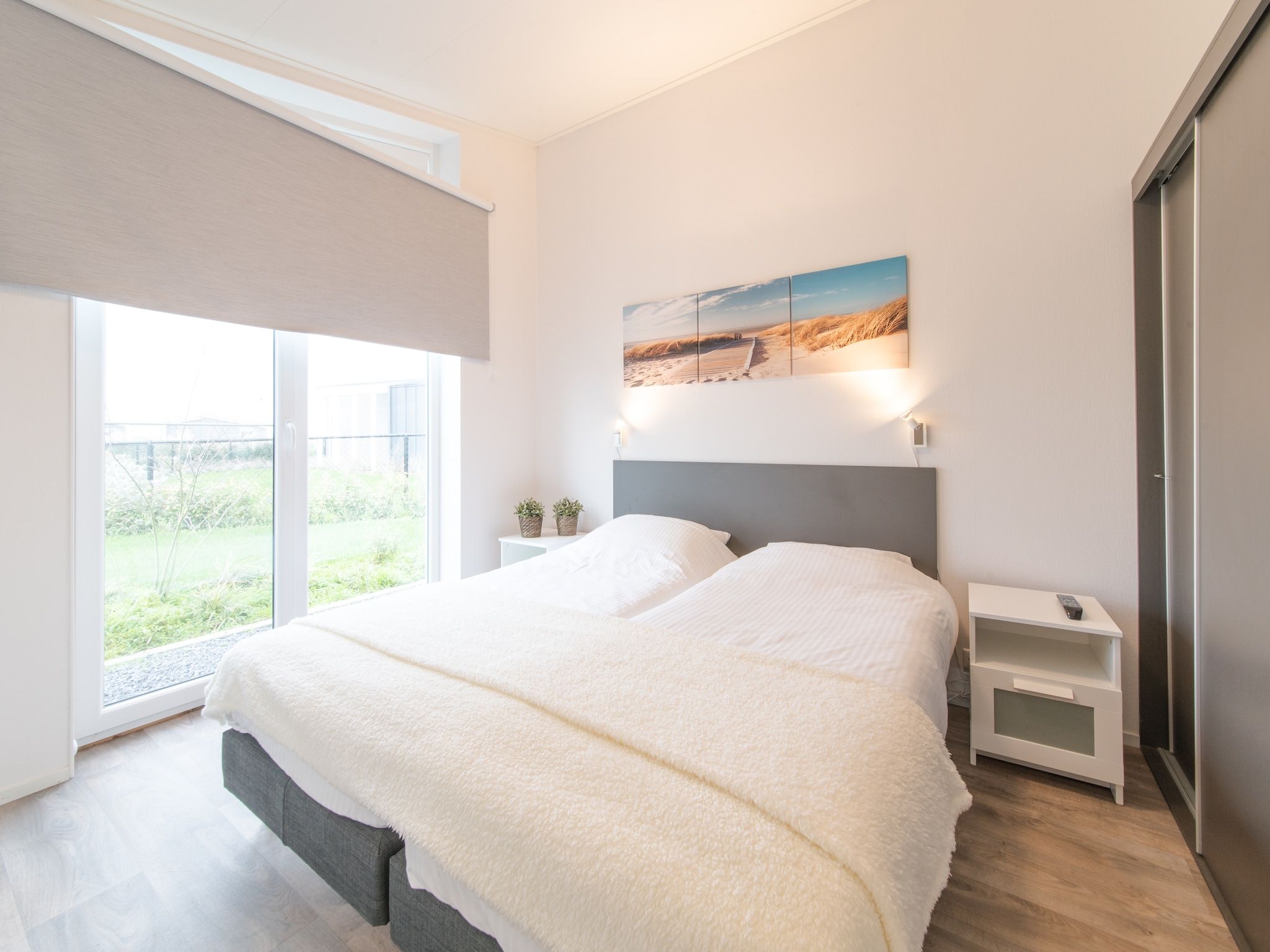 Een slaapkamer van Water Resort Oosterschelde 38 in Wemeldinge