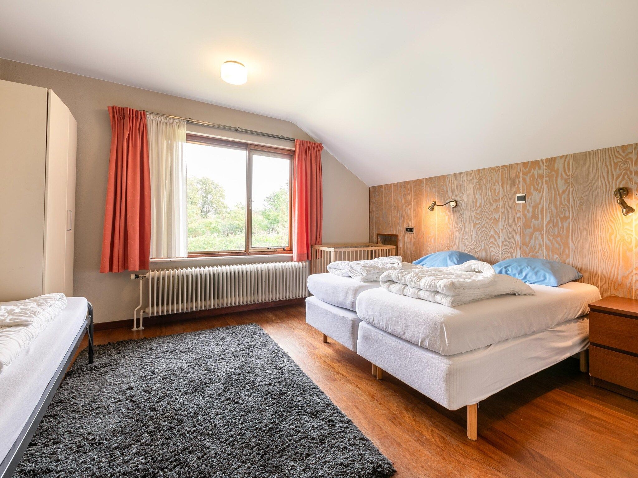 Een slaapkamer van Vakantiepark Herperduin 21 in Herpen