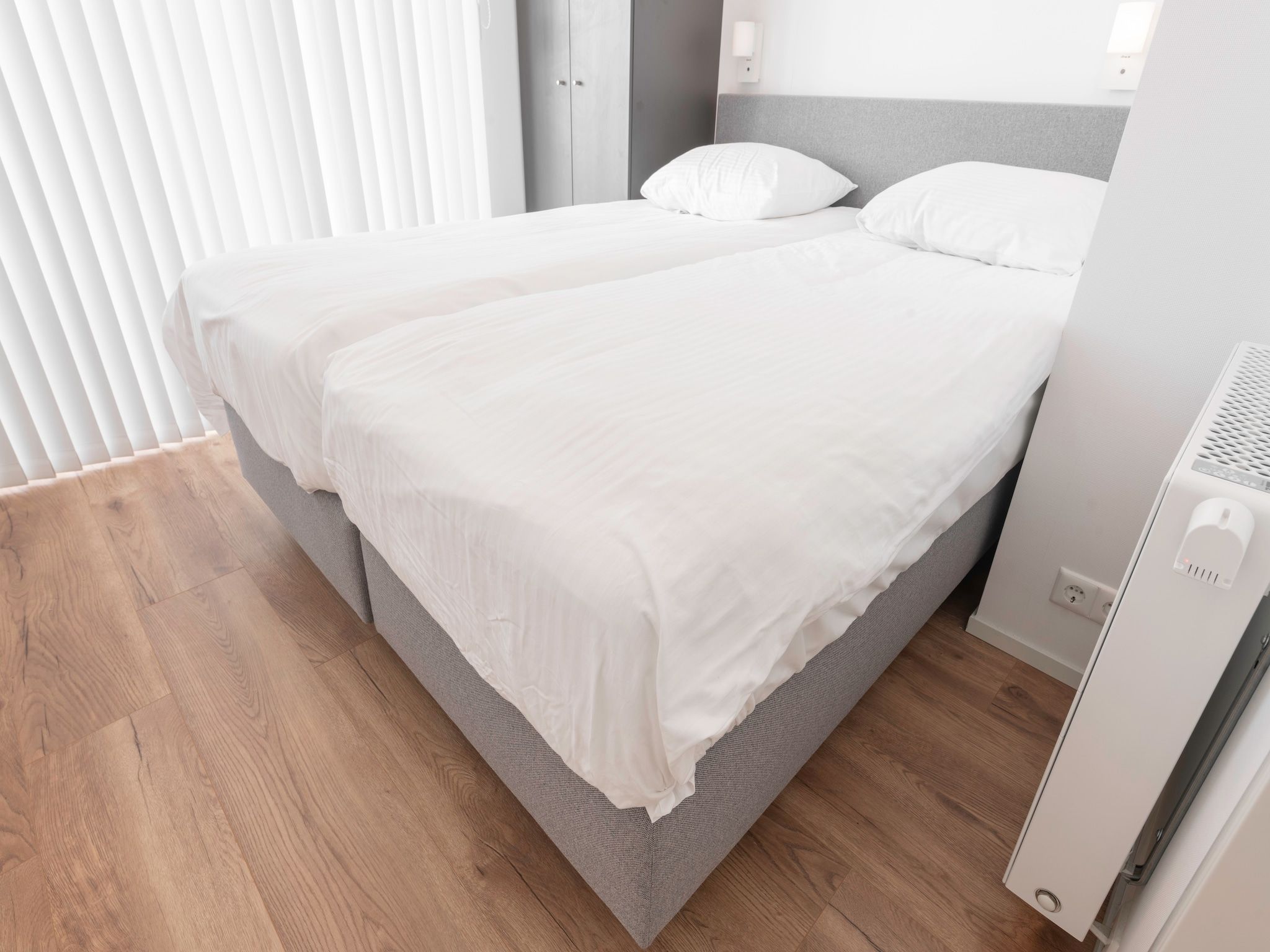 Een slaapkamer van Water Resort Oosterschelde 55 in Wemeldinge