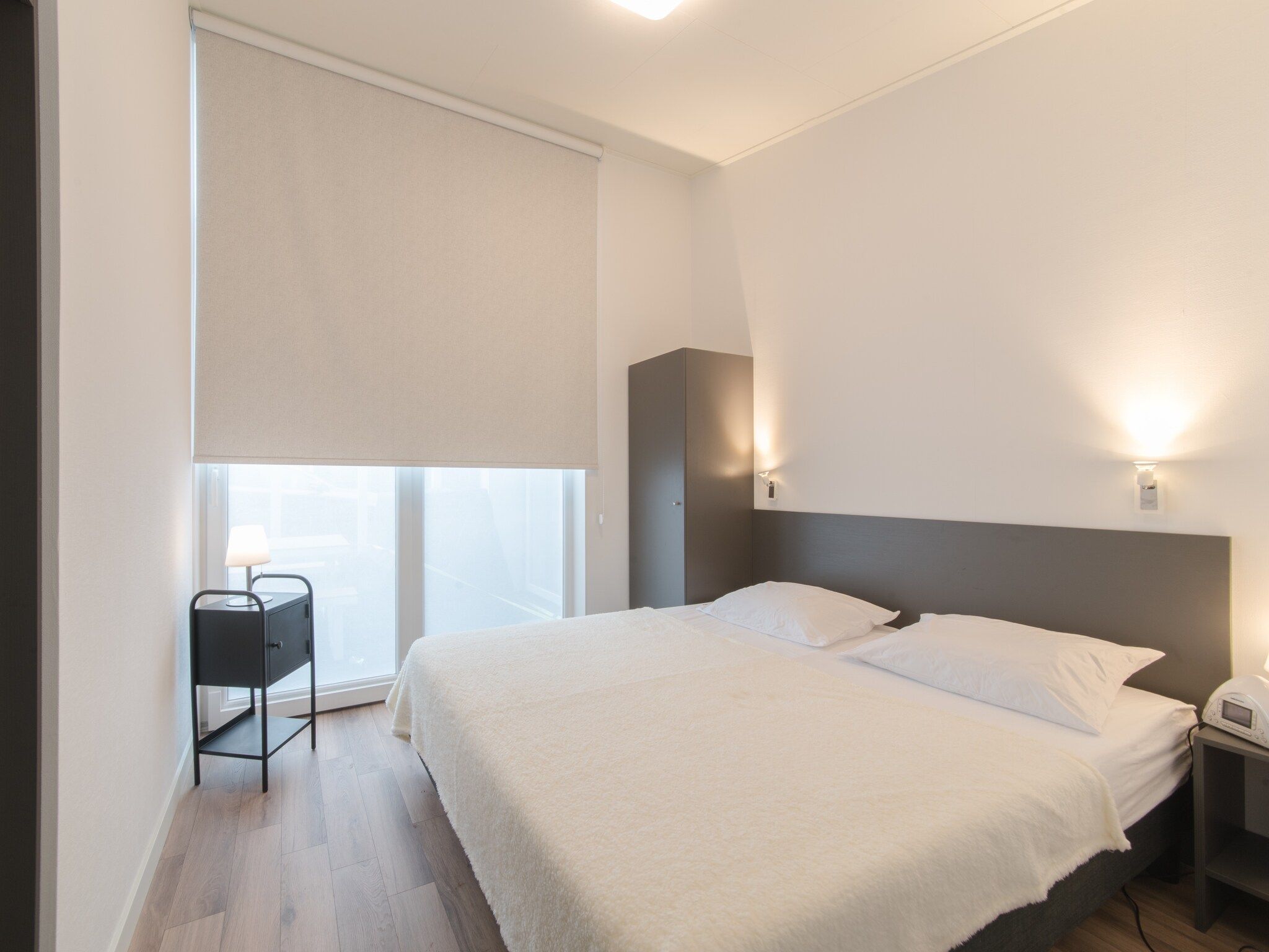 Een slaapkamer van Water Resort Oosterschelde 76 in Wemeldinge