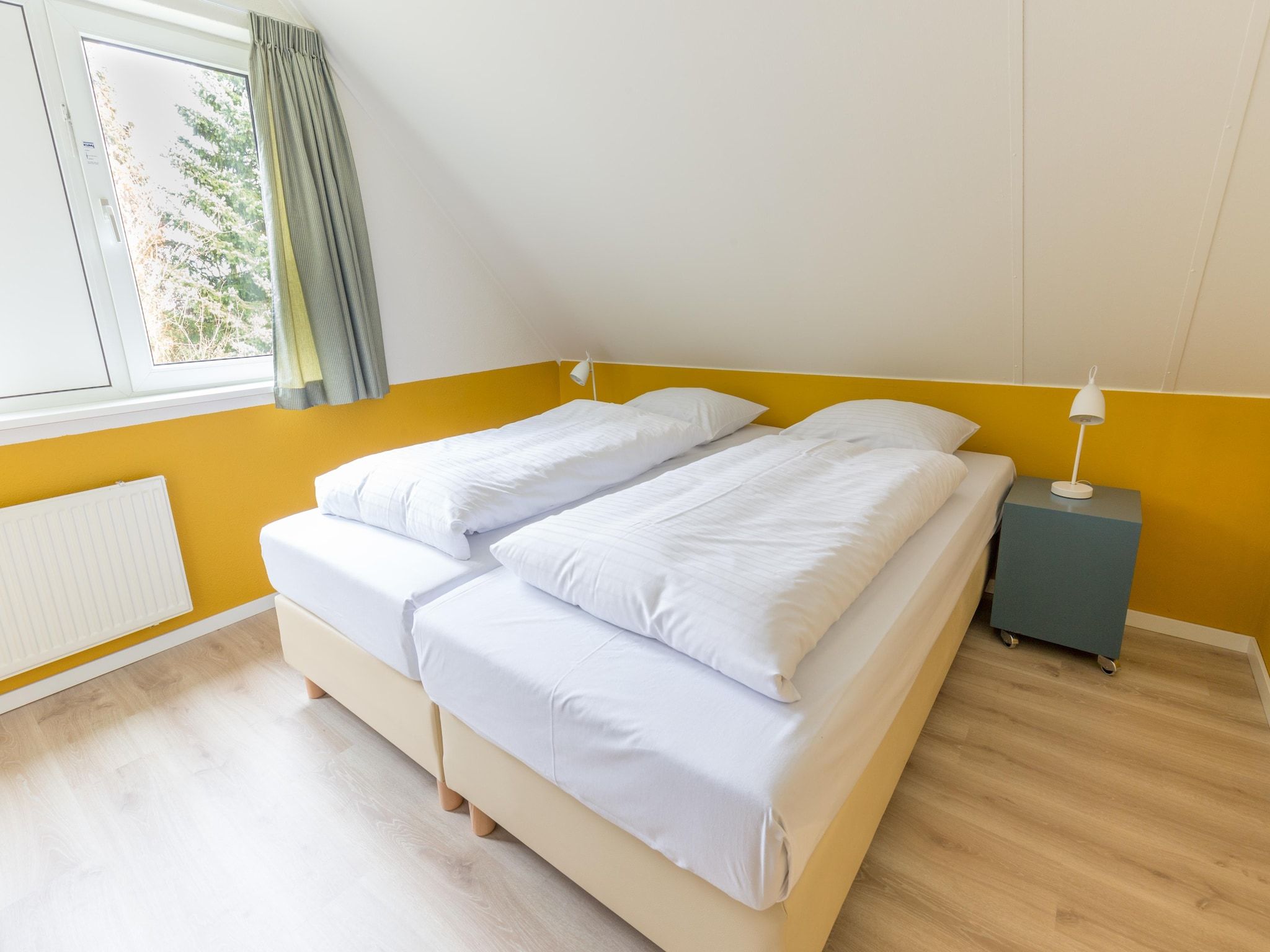 Een slaapkamer van Vakantiepark Emslandermeer 19 in Vlagtwedde