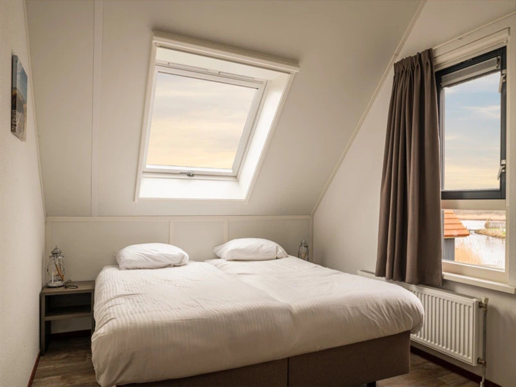 Een slaapkamer van Waterpark Langelille 5 in Langelille