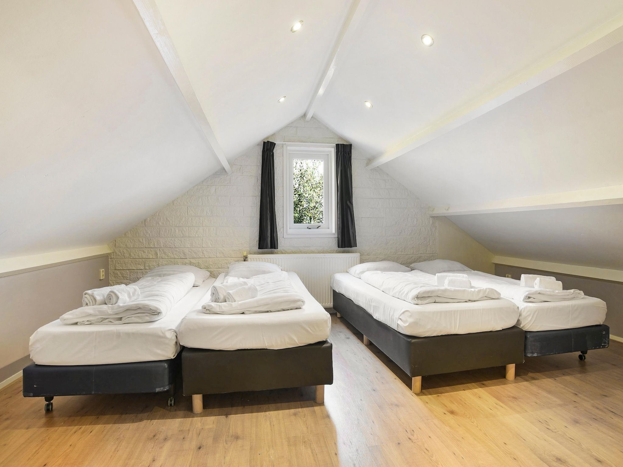 Een slaapkamer van Waterpark De Bloemert 3 in Midlaren