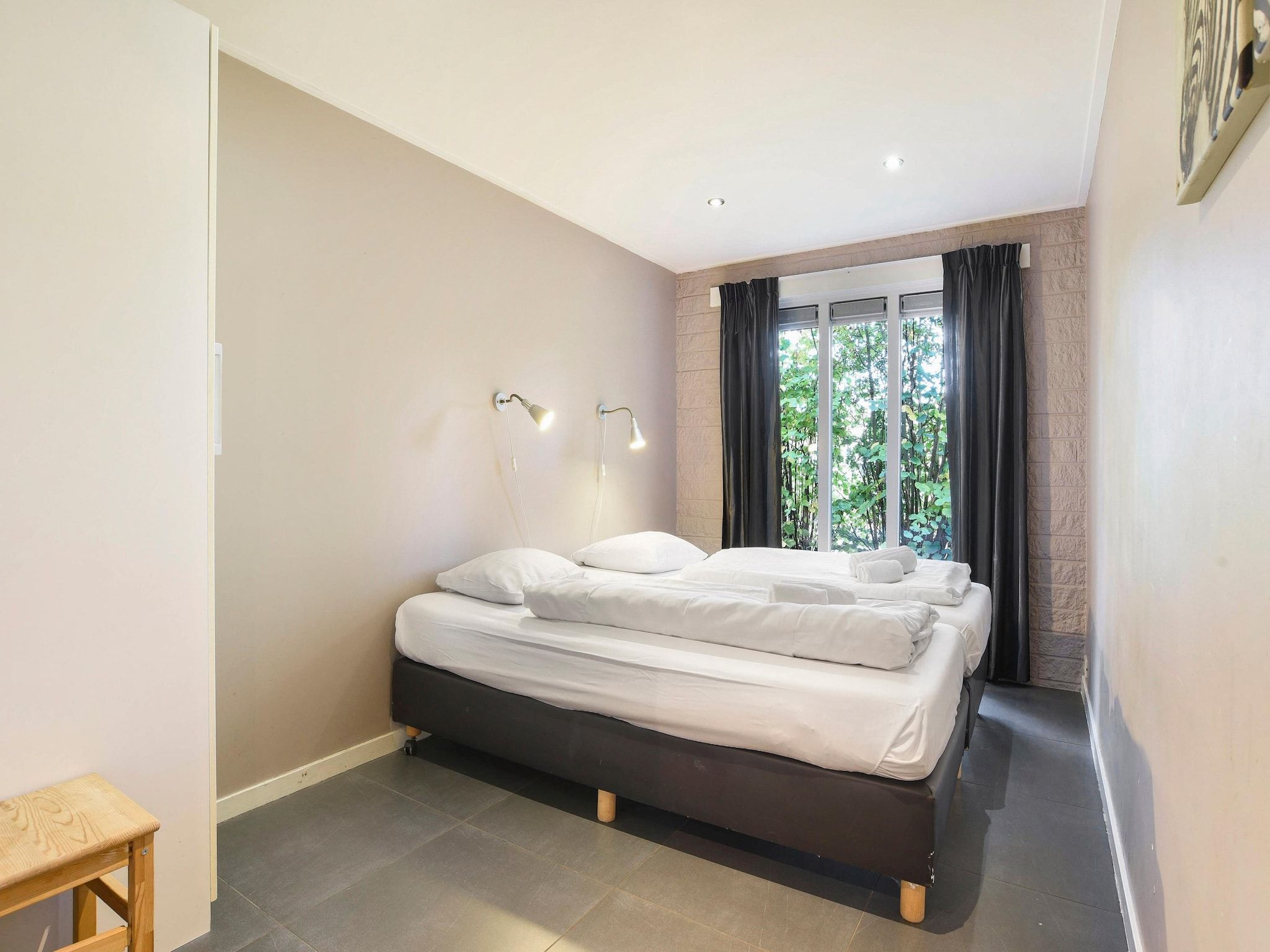 Een slaapkamer van Waterpark De Bloemert 3 in Midlaren