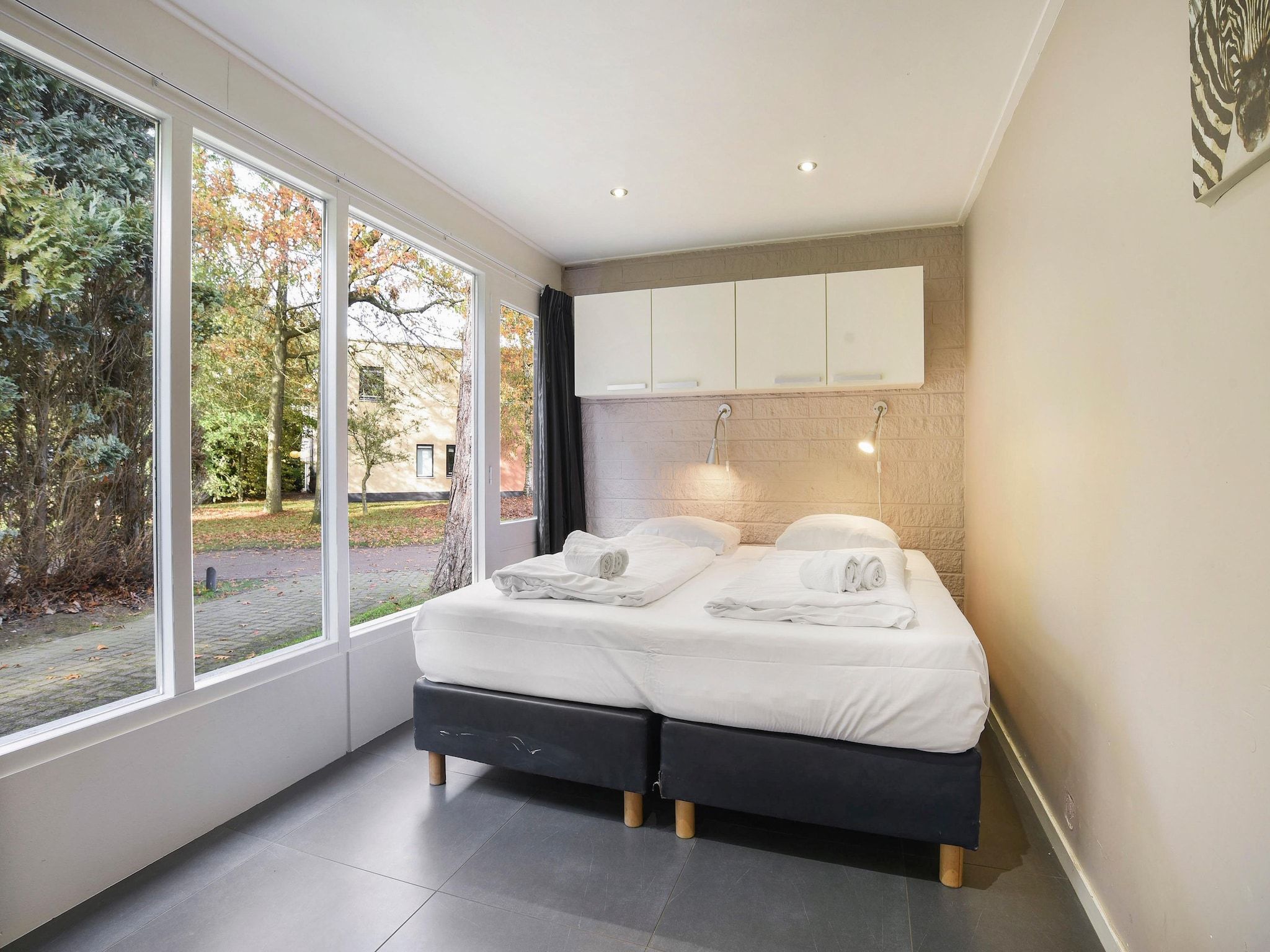 Een slaapkamer van Waterpark De Bloemert 3 in Midlaren