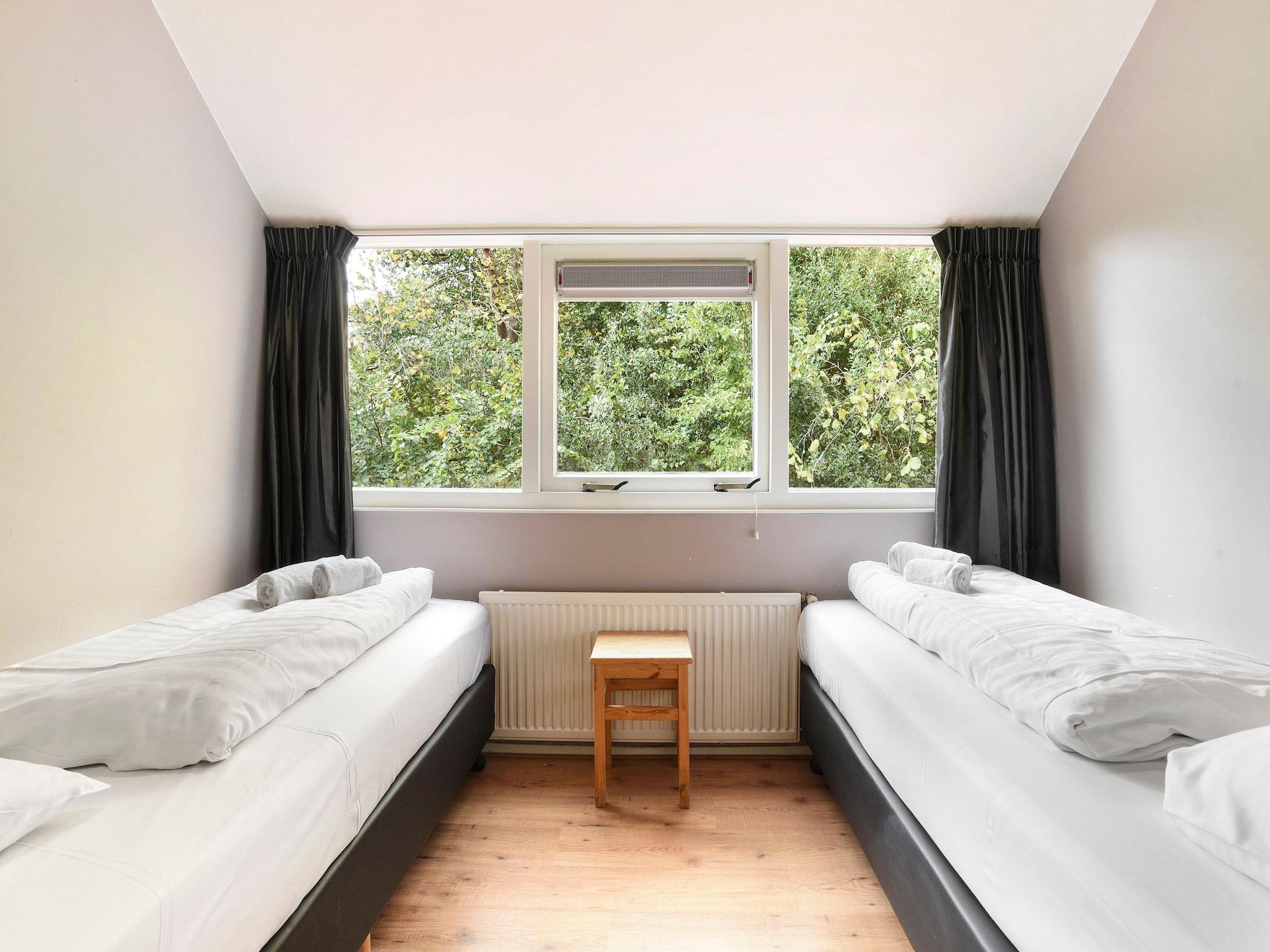 Een slaapkamer van Waterpark De Bloemert 3 in Midlaren