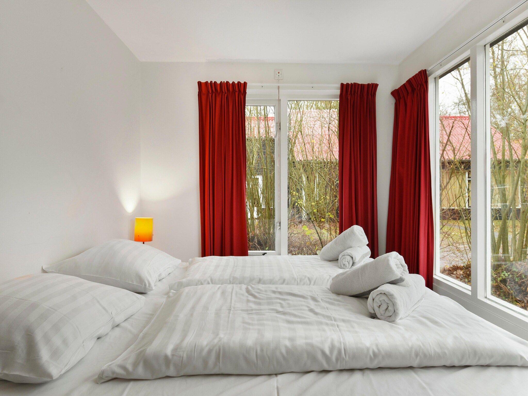 Een slaapkamer van Waterpark De Bloemert 4 in Midlaren