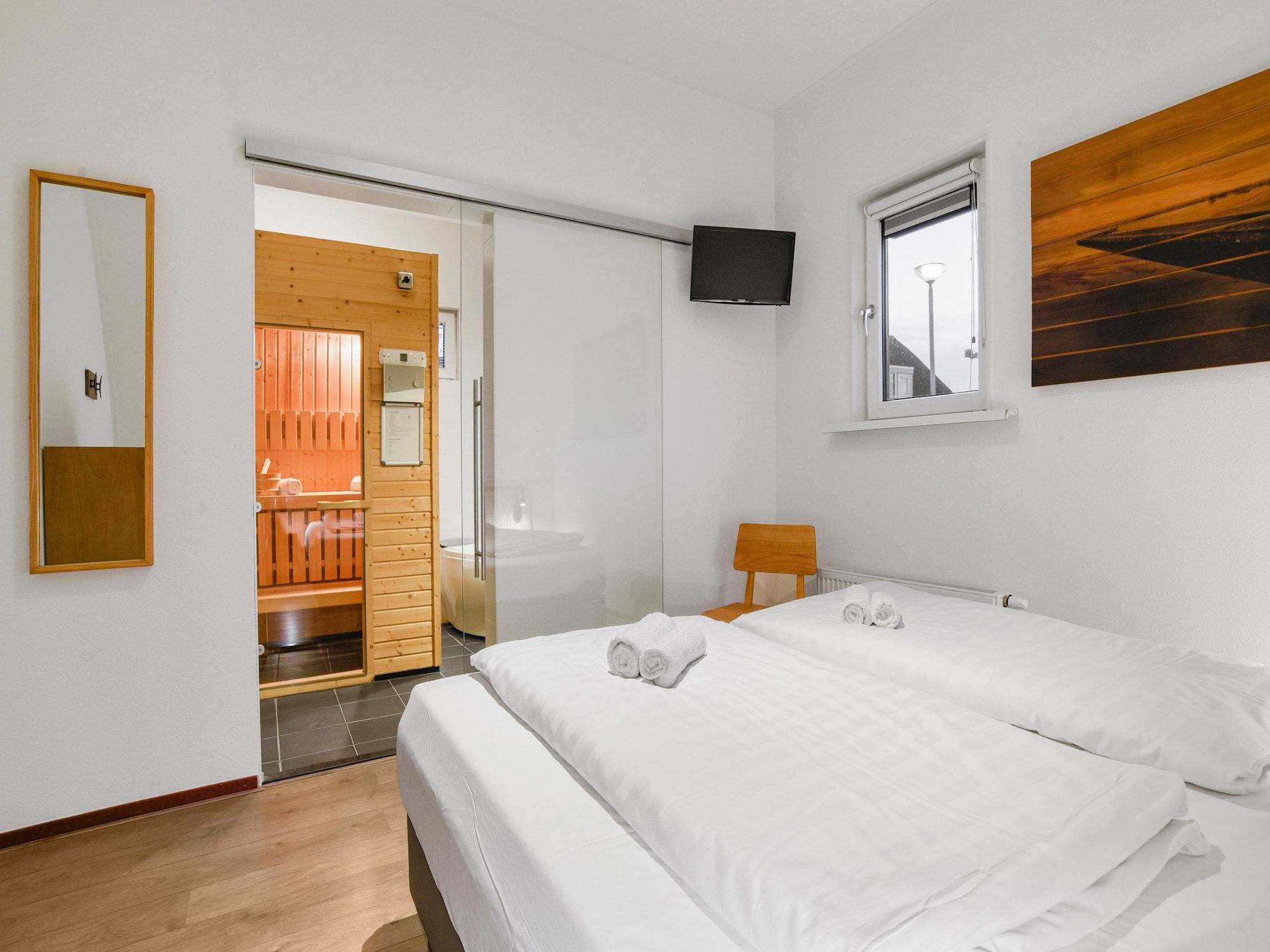 Een slaapkamer van Waterpark De Bloemert 7 in Midlaren