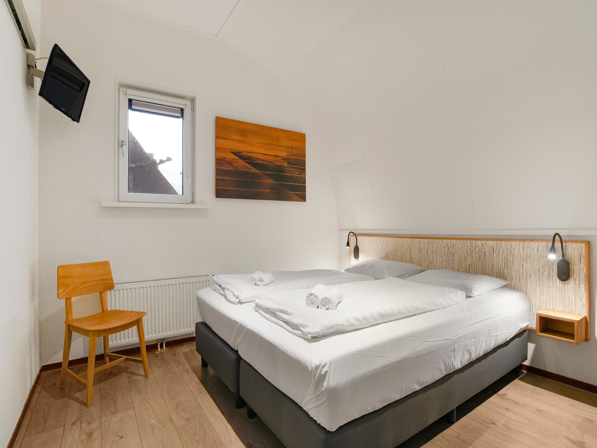 Een slaapkamer van Waterpark De Bloemert 7 in Midlaren