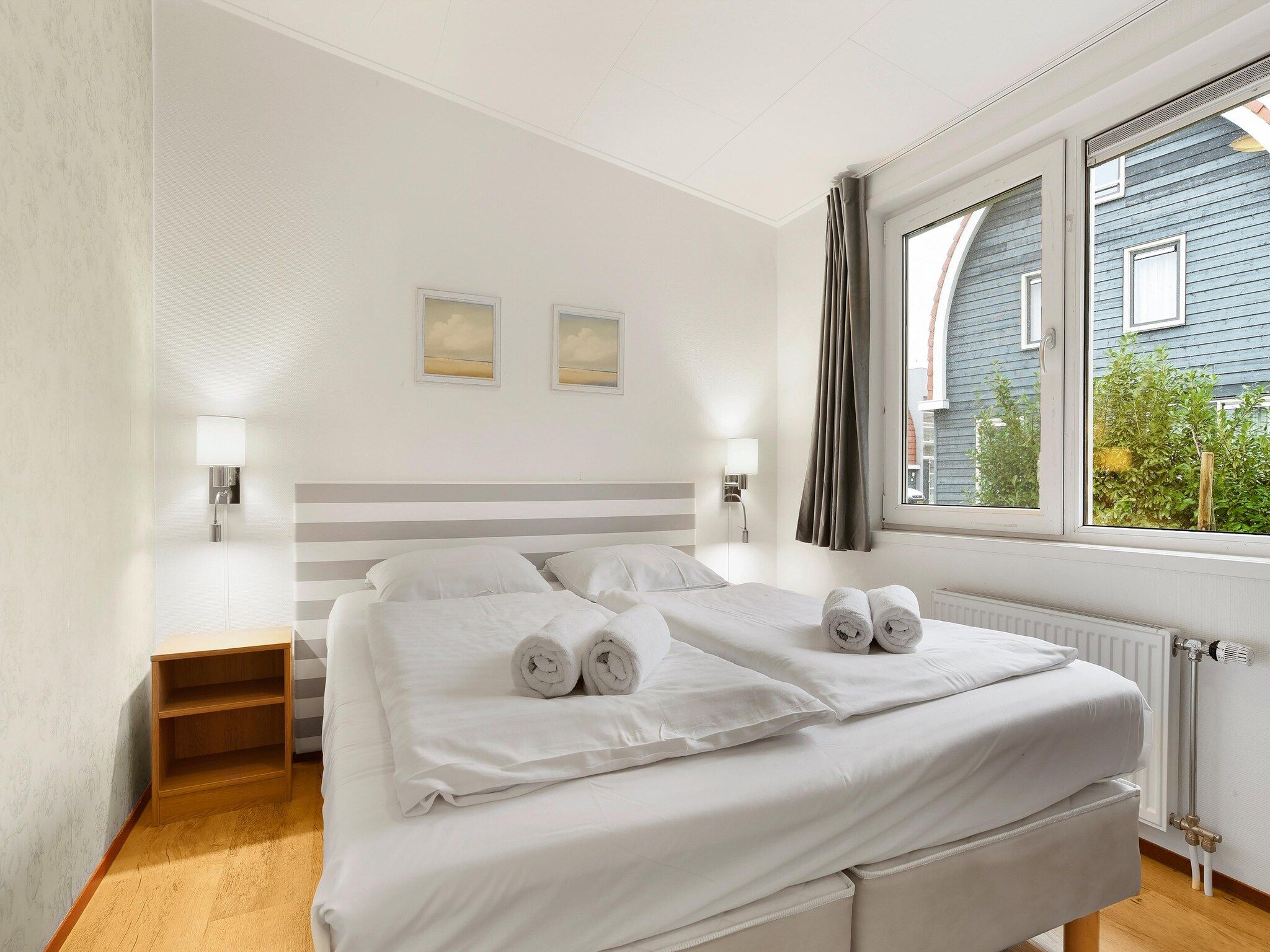 Een slaapkamer van Waterpark De Bloemert 8 in Midlaren