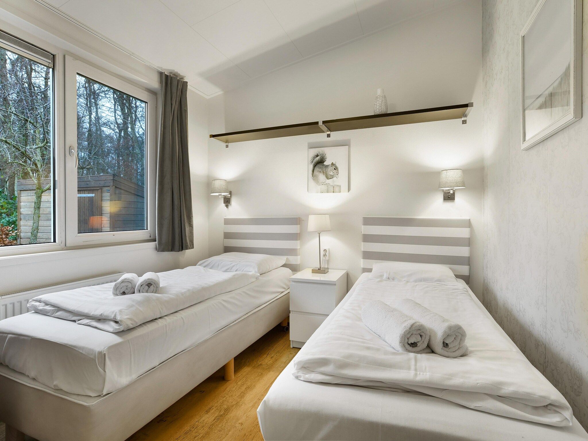 Een slaapkamer van Waterpark De Bloemert 8 in Midlaren