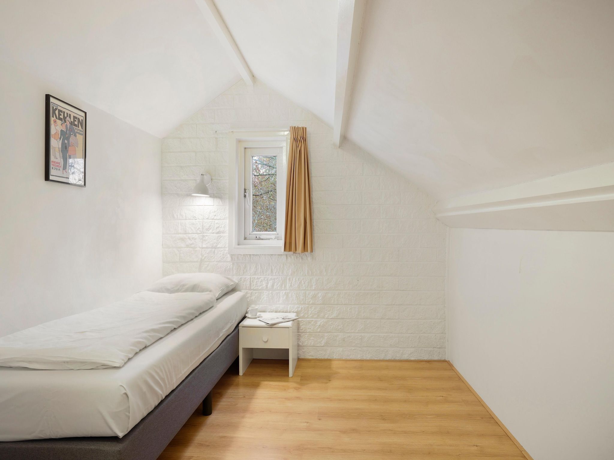 Een slaapkamer van Waterpark De Bloemert 12 in Midlaren