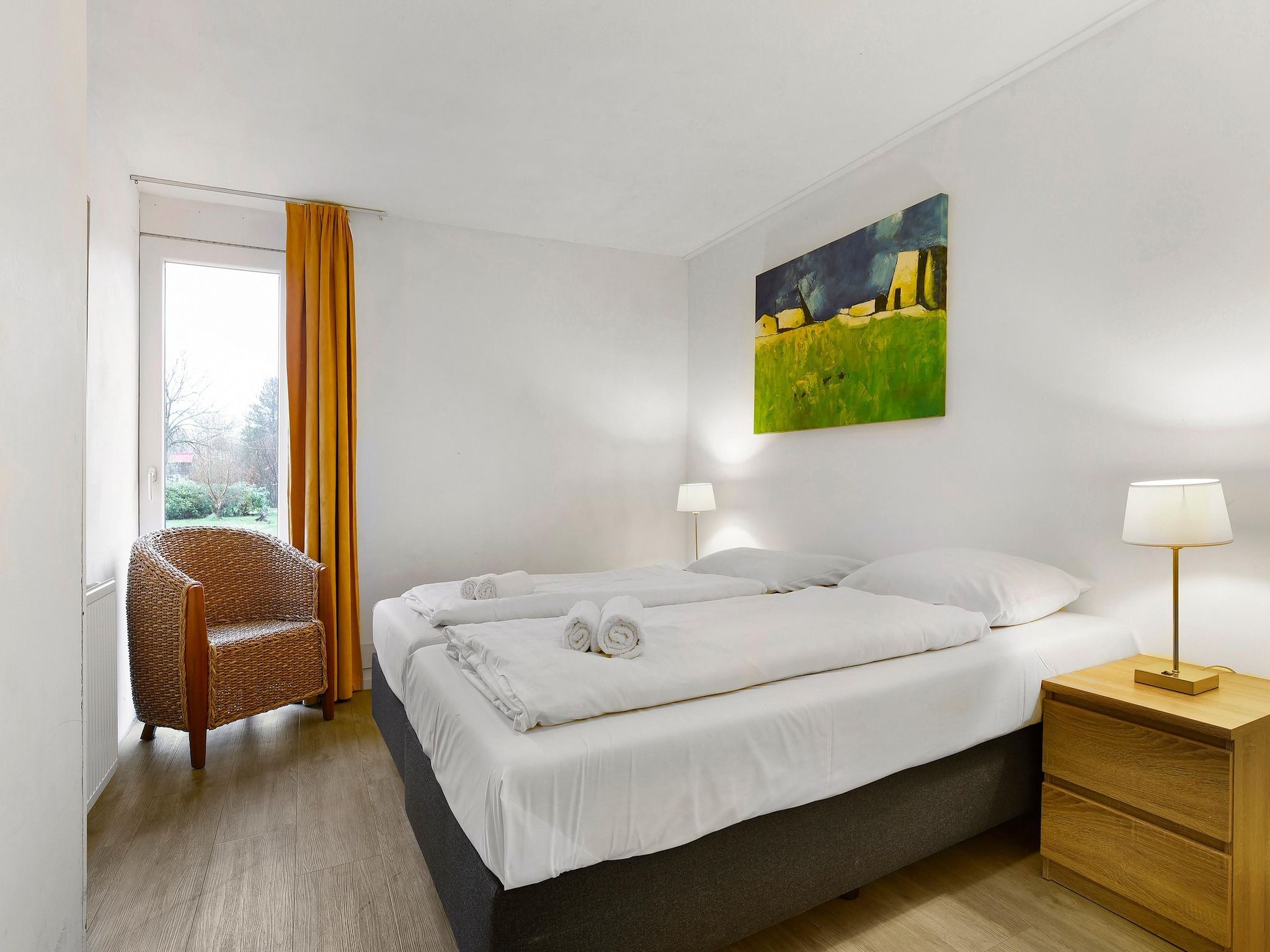 Een slaapkamer van Waterpark De Bloemert 14 in Midlaren