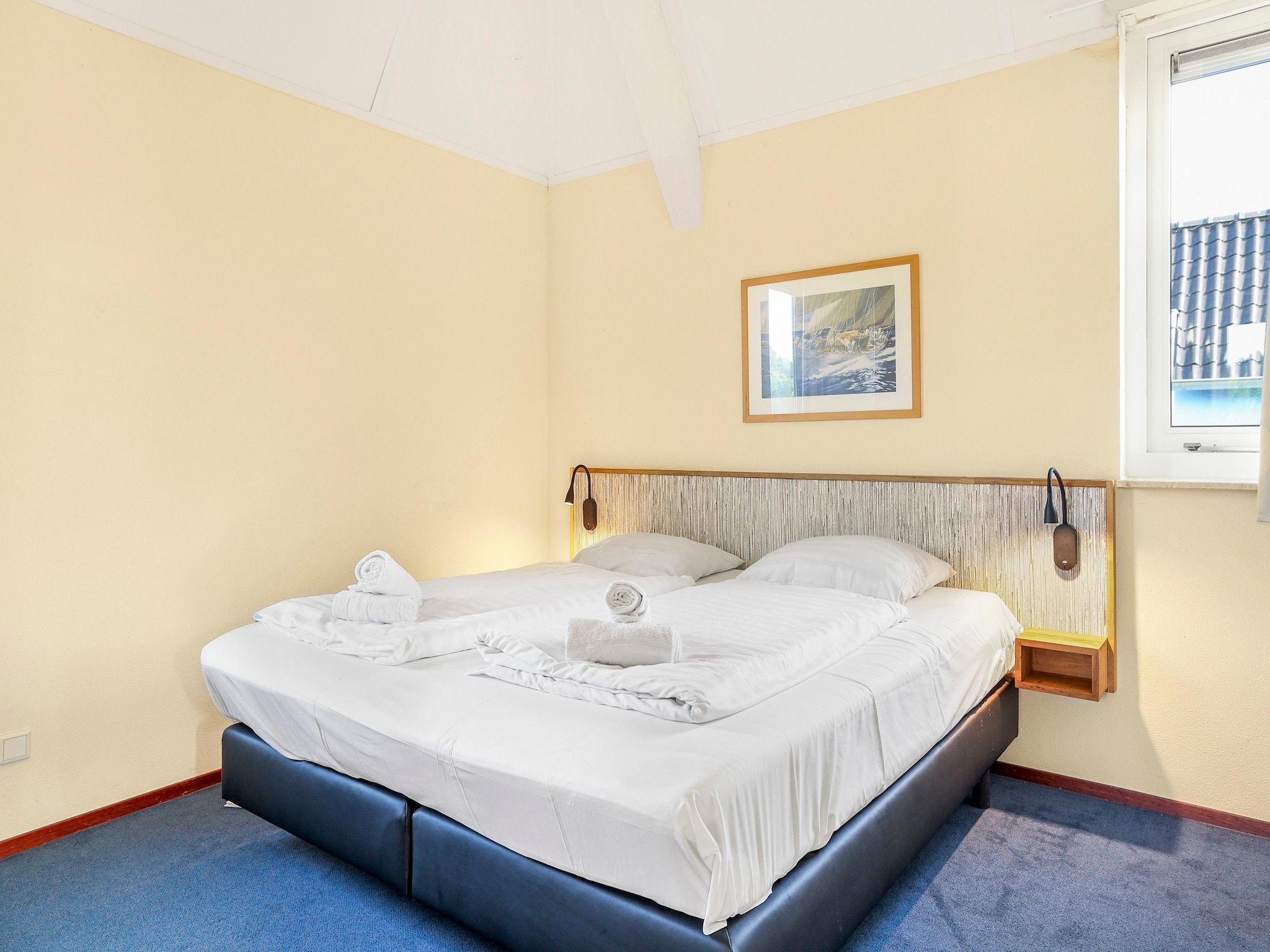 Een slaapkamer van Waterpark De Bloemert 15 in Midlaren