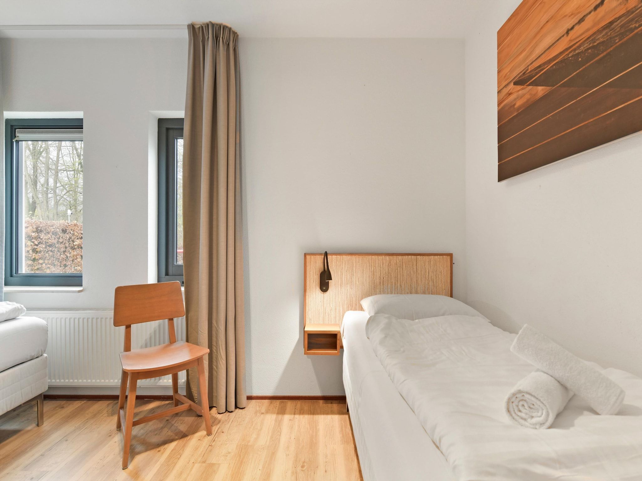 Een slaapkamer van Waterpark De Bloemert 16 in Midlaren