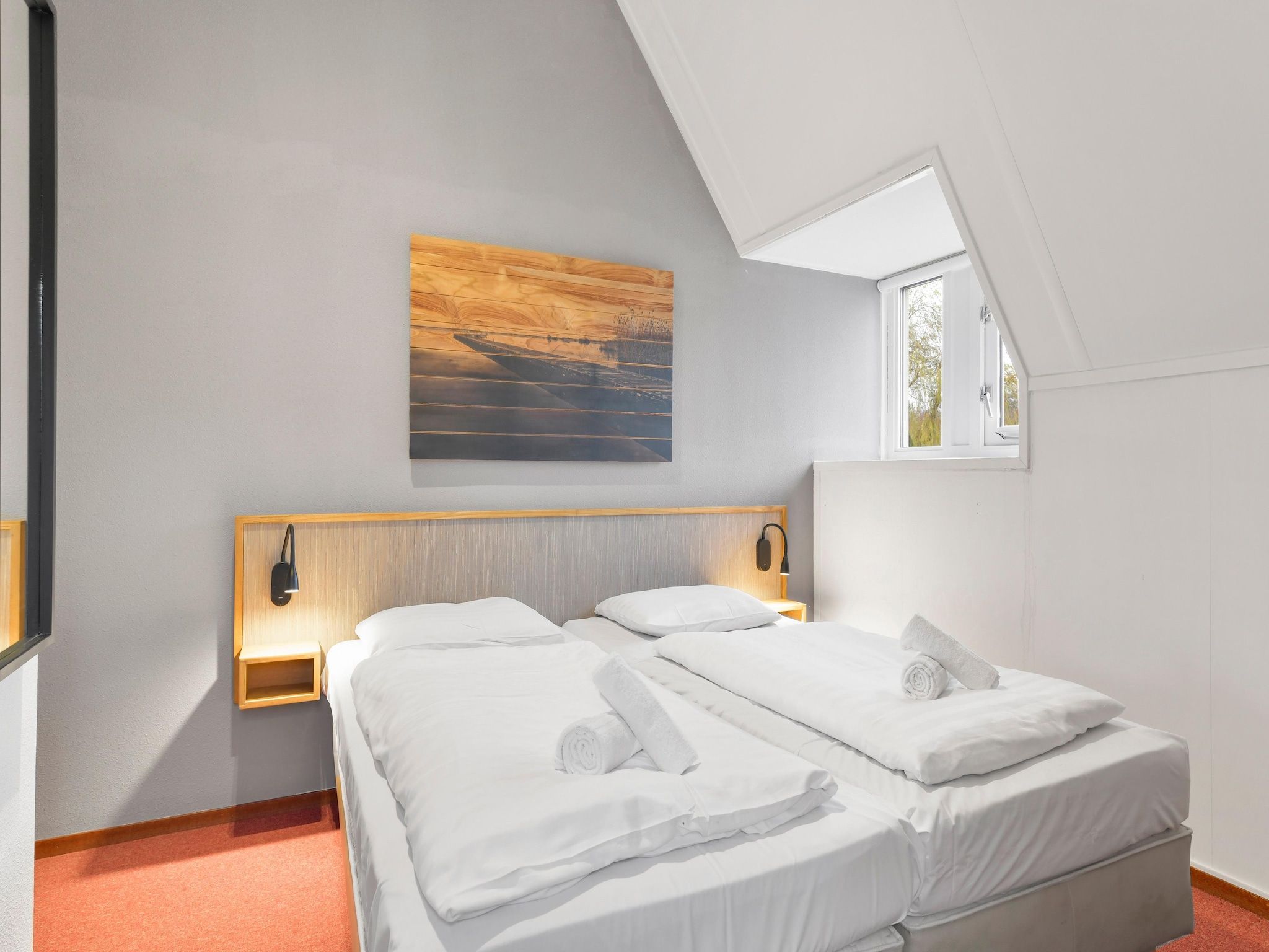 Een slaapkamer van Waterpark De Bloemert 17 in Midlaren