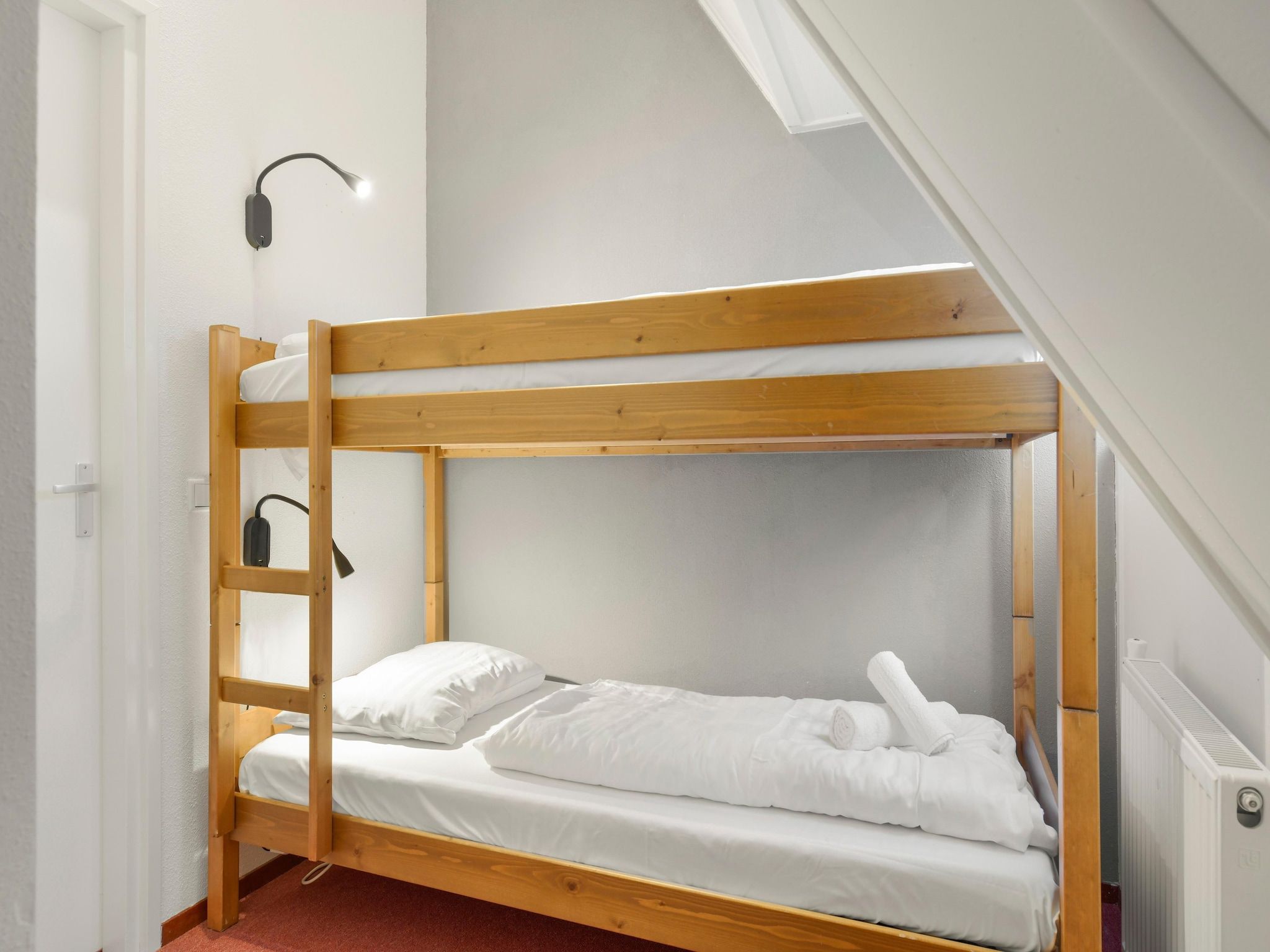 Een slaapkamer van Waterpark De Bloemert 17 in Midlaren