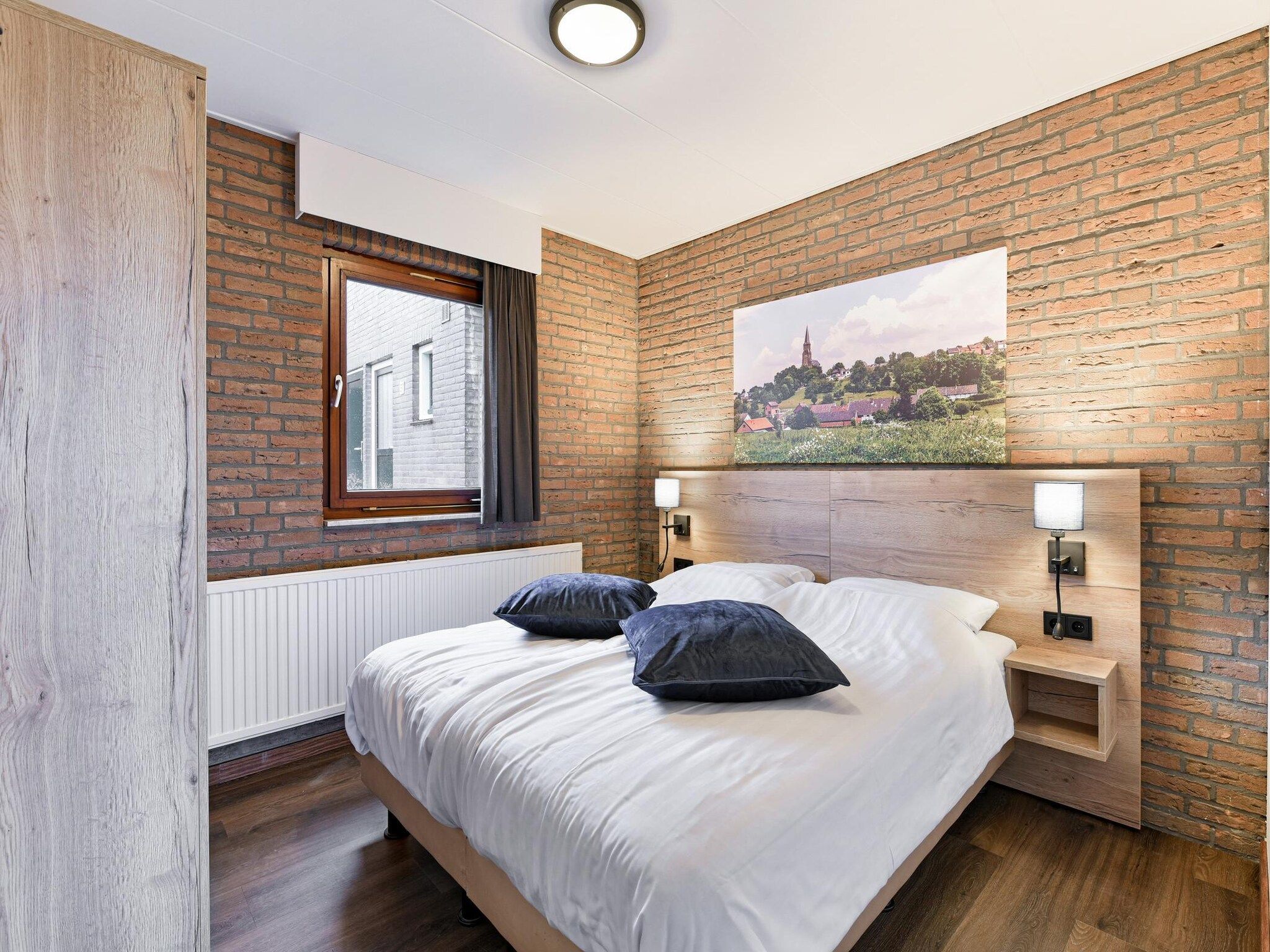 Een slaapkamer van Bungalow 2A in Vijlen