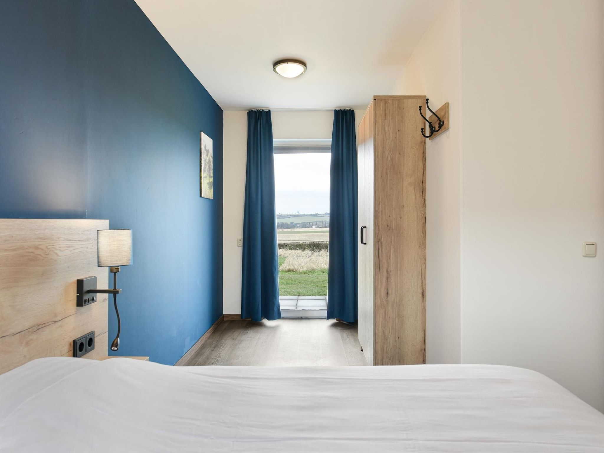 Een slaapkamer van Bungalow 2B in Vijlen