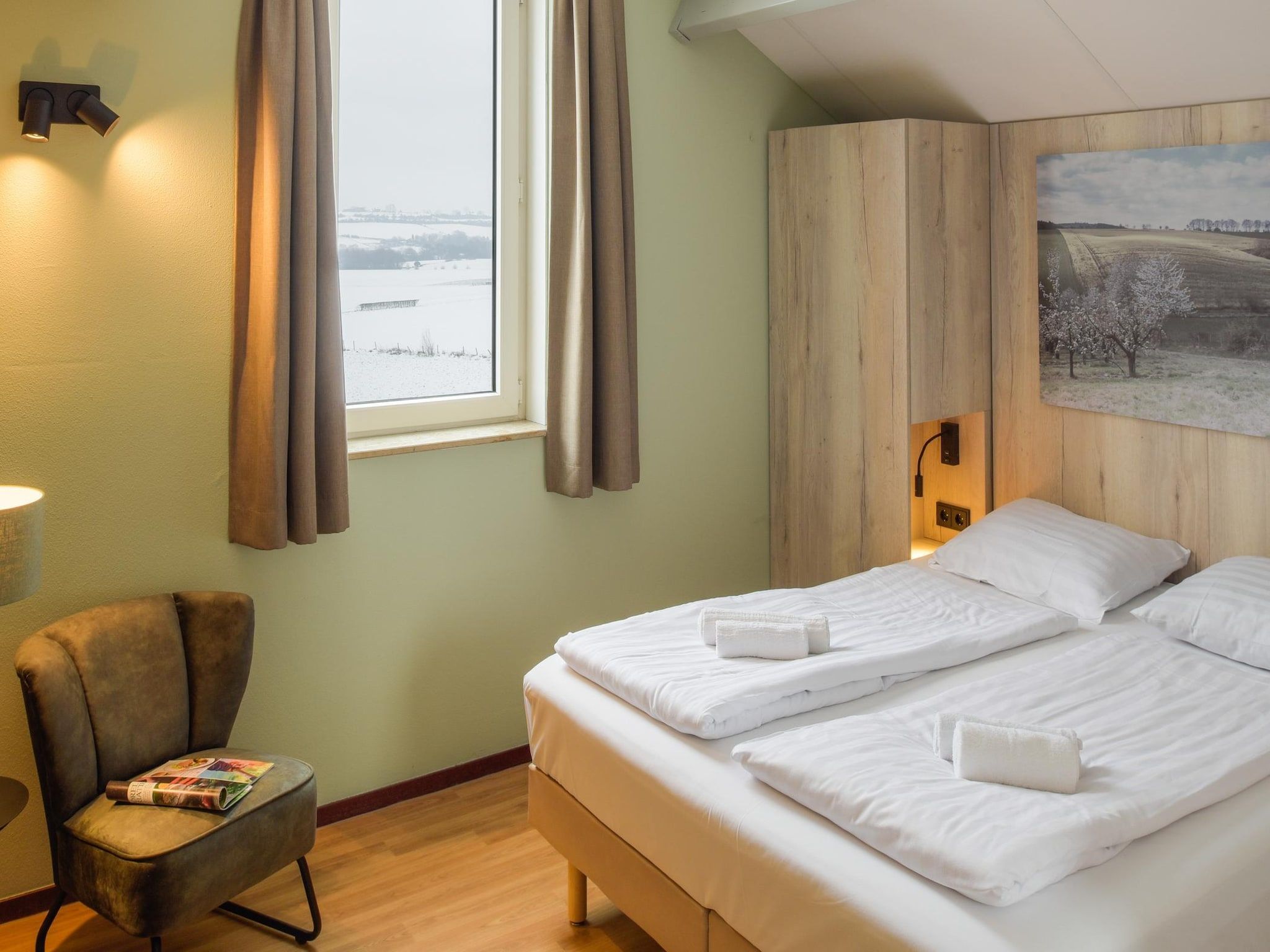 Een slaapkamer van Vakantiepark Reevallis 4 in Vijlen