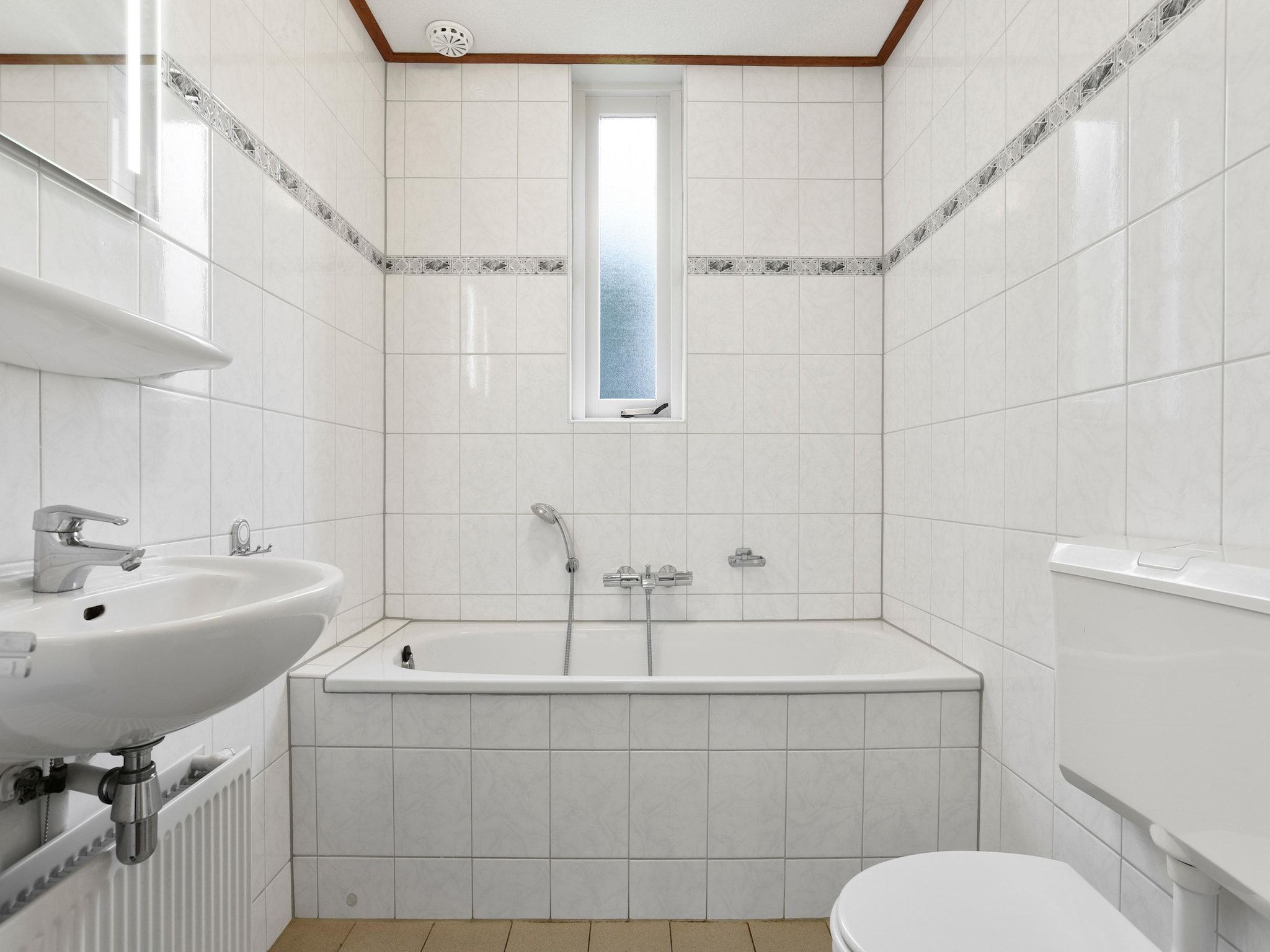 De badkamer van Parc Port Greve 18 in Brouwershaven