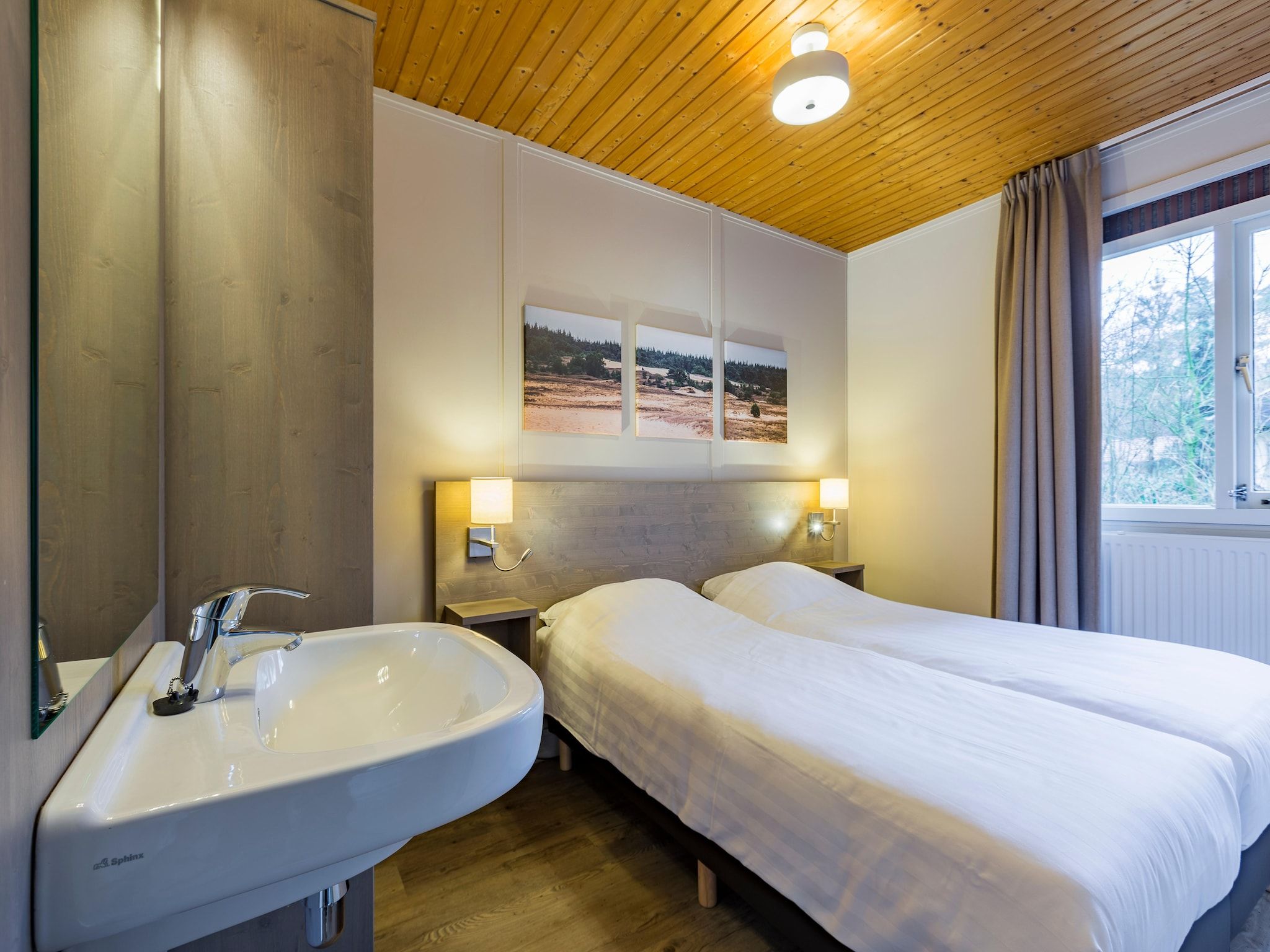 Een slaapkamer van Parc Heihaas 1 in Putten