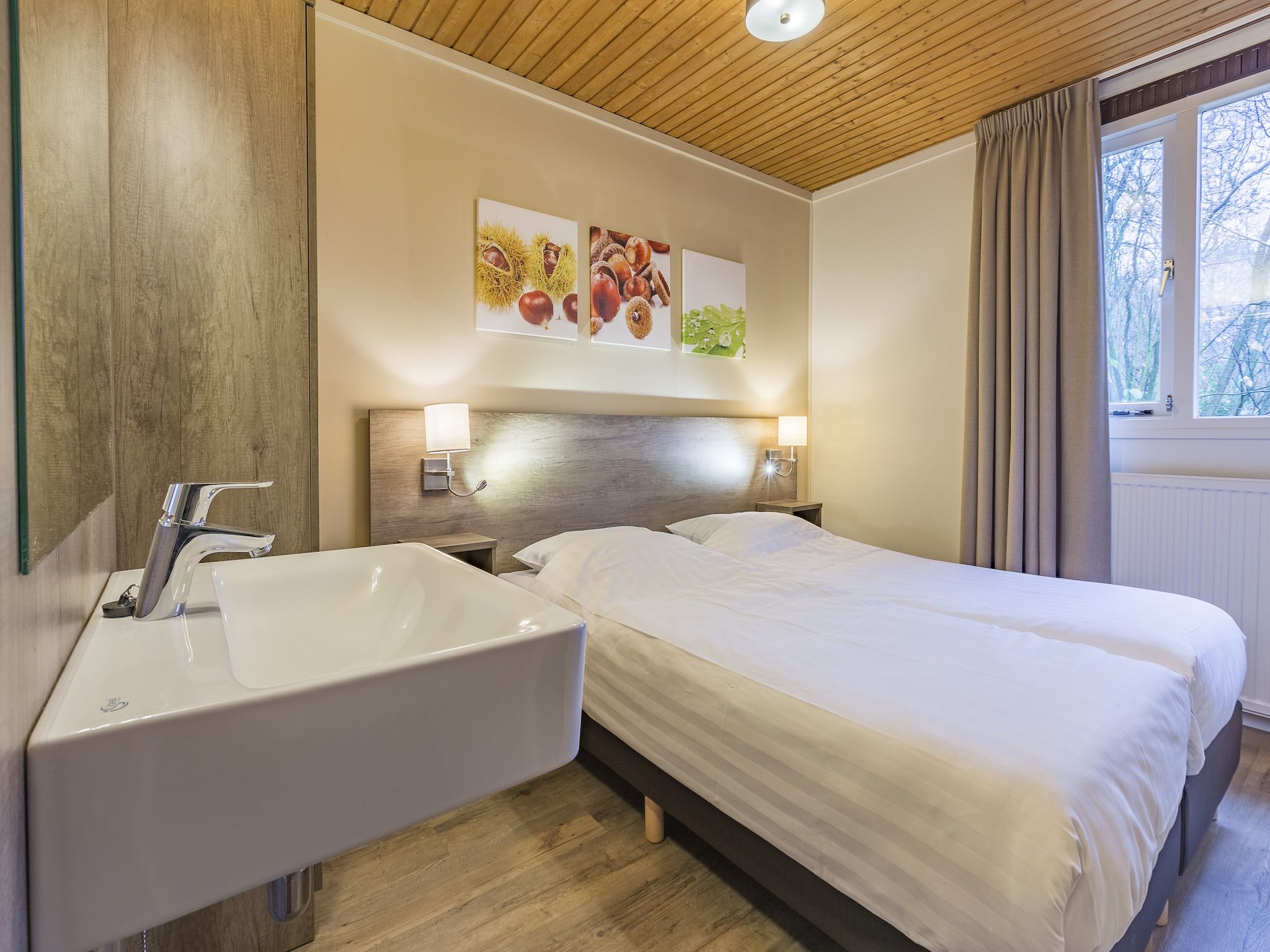 Een slaapkamer van Parc Heihaas 2 in Putten