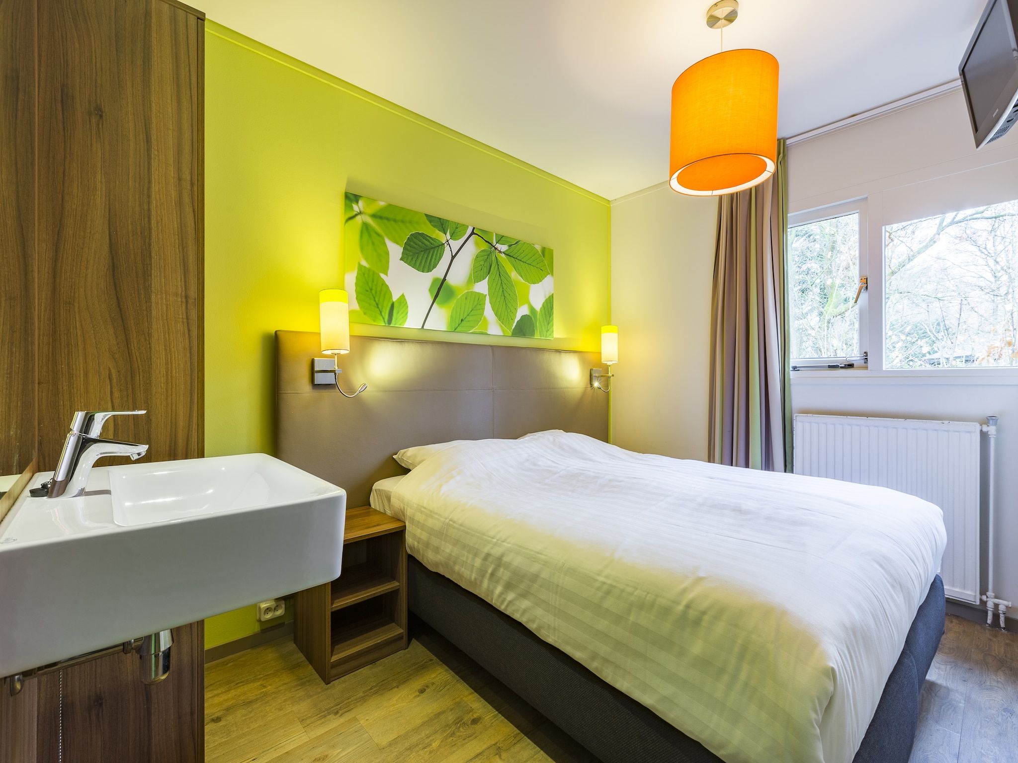 Een slaapkamer van Parc Heihaas 2 in Putten