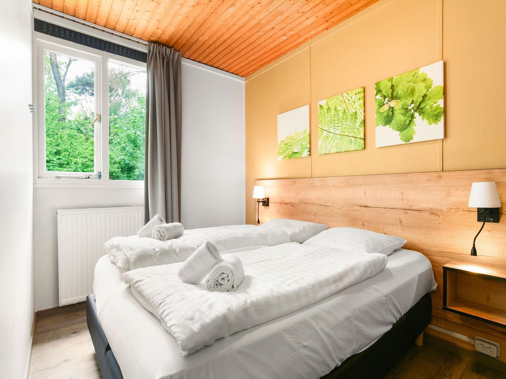 Een slaapkamer van Parc Heihaas 11 in Putten