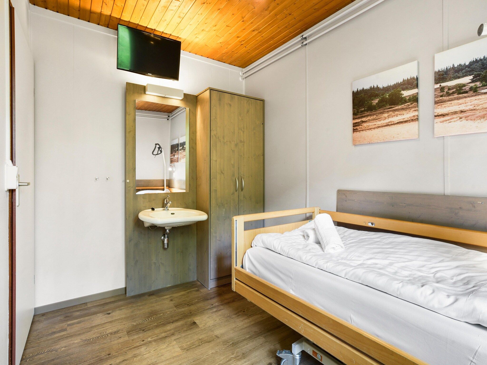 Een slaapkamer van Parc Heihaas 13 in Putten
