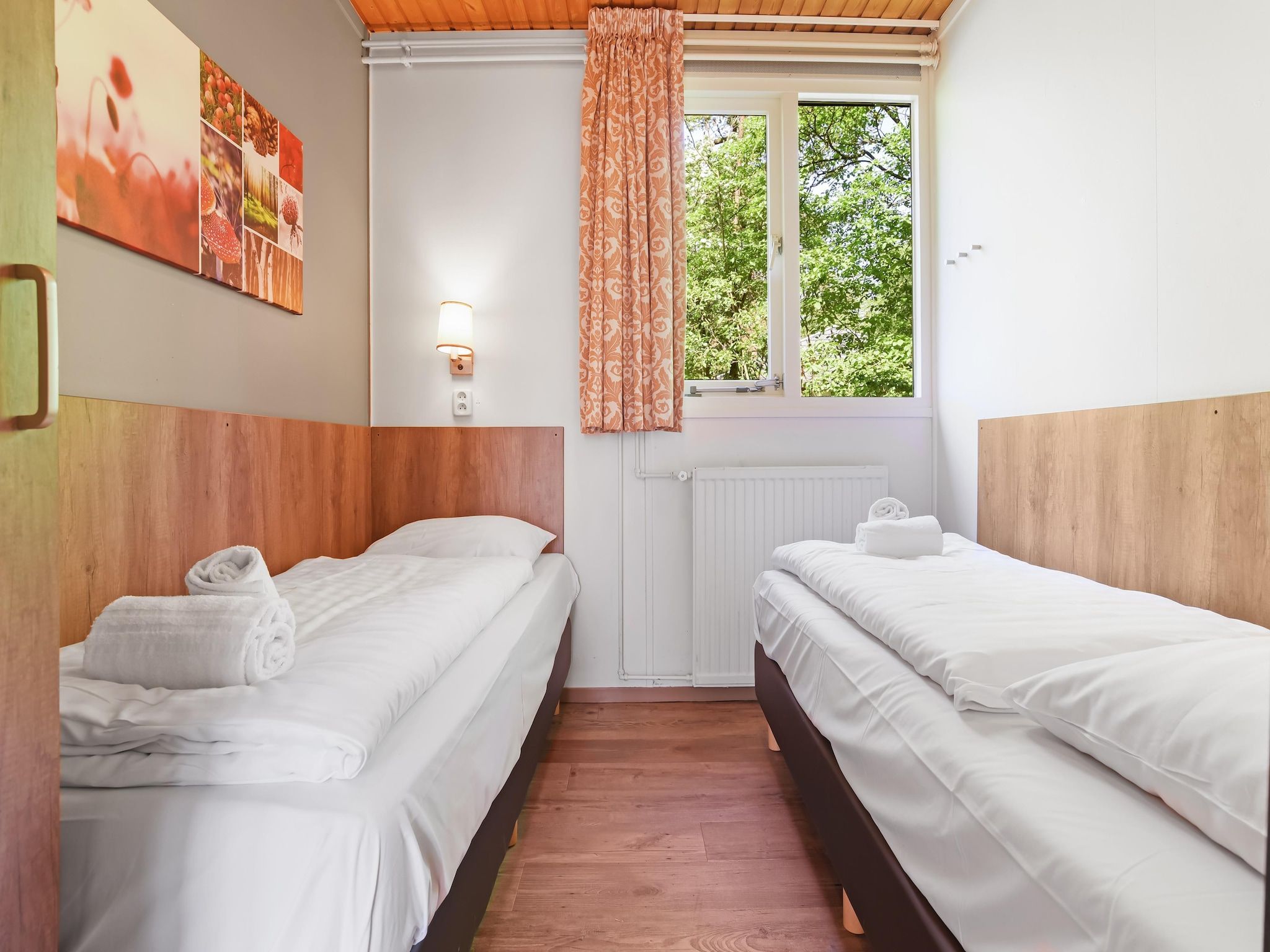 Een slaapkamer van Parc Heihaas 14 in Putten