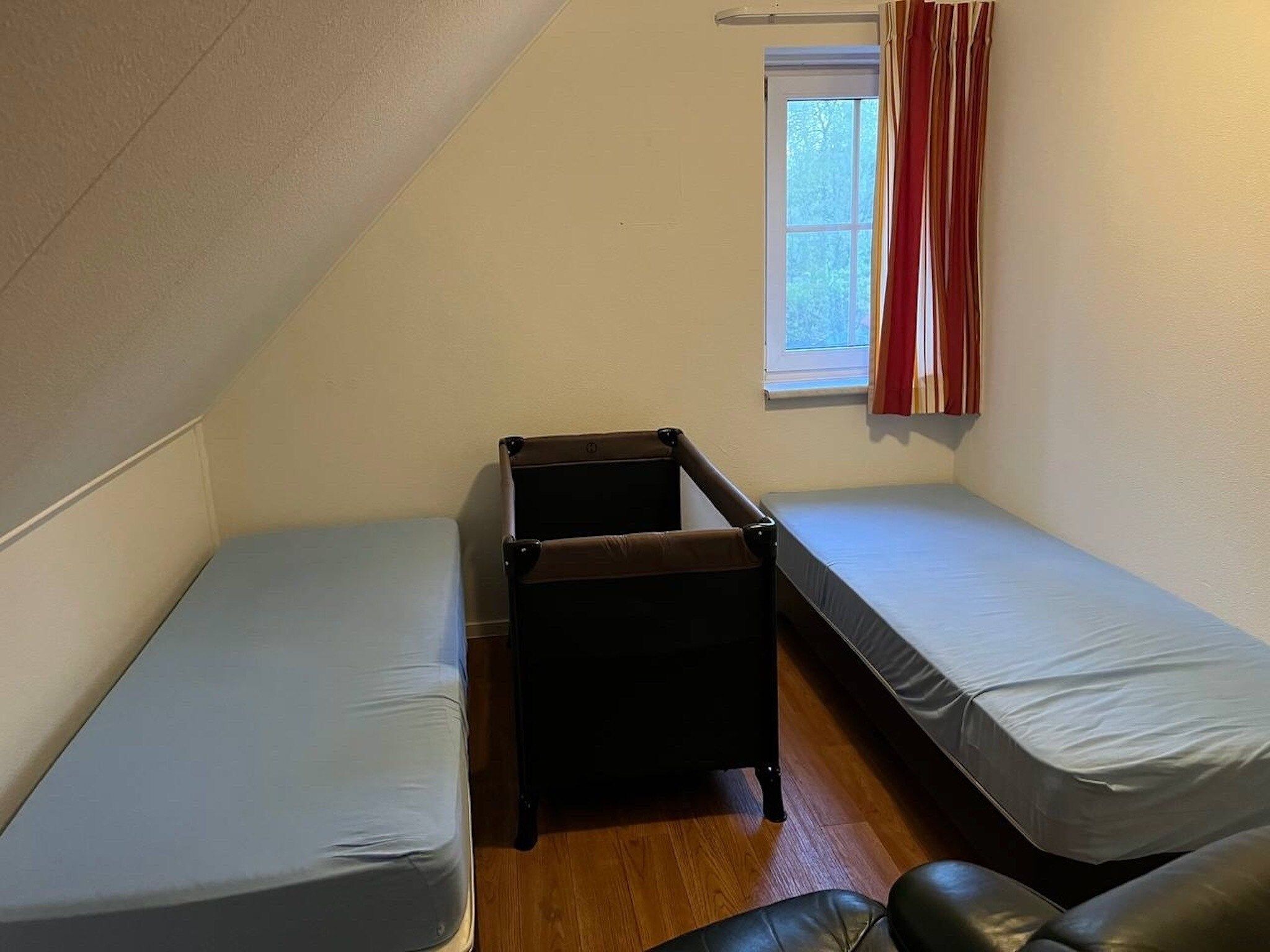 Een slaapkamer van Vakantiepark Hellendoorn 6 in Hellendoorn