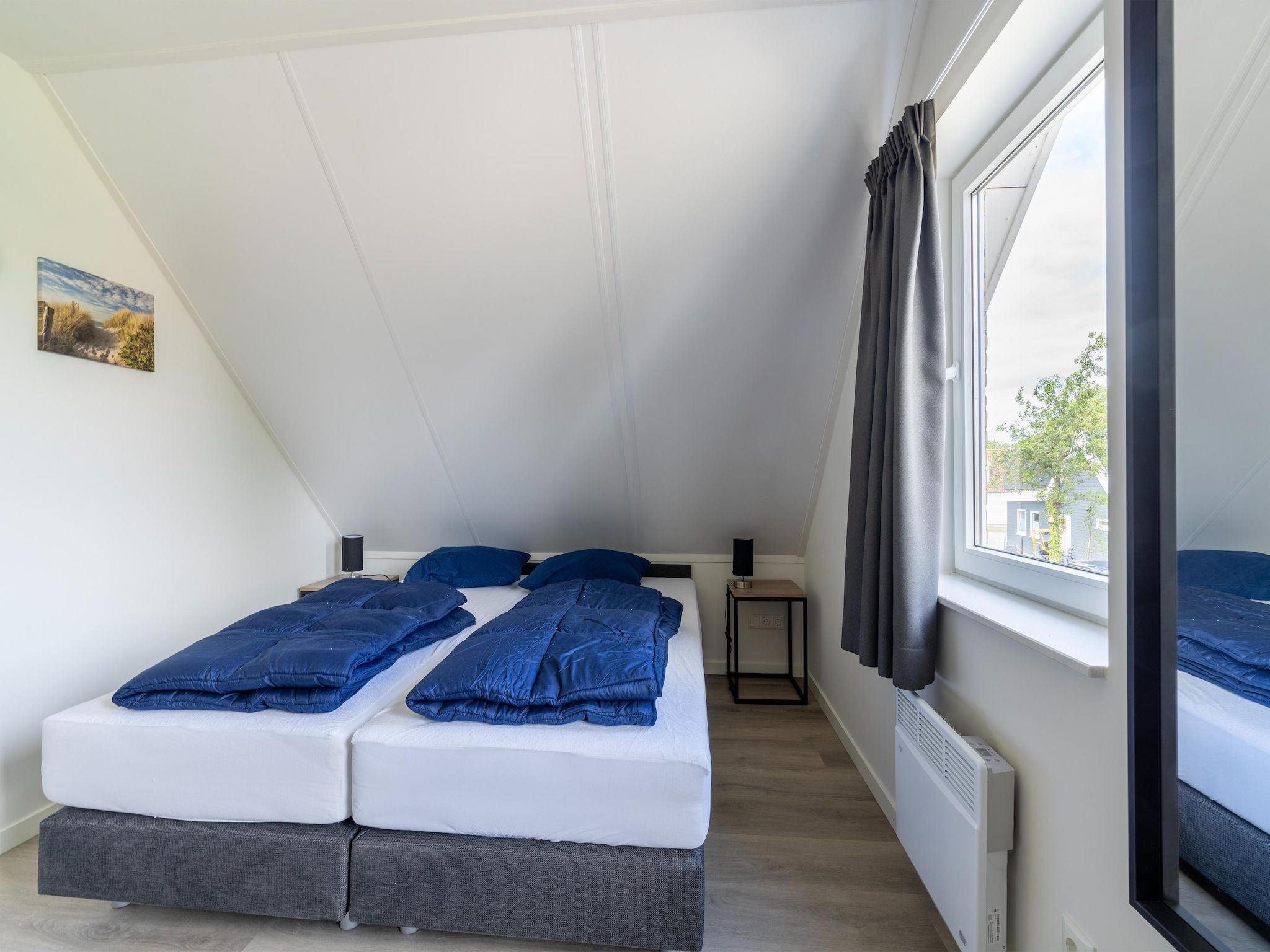 Een slaapkamer van Kuifduiker 5 in Simonshaven