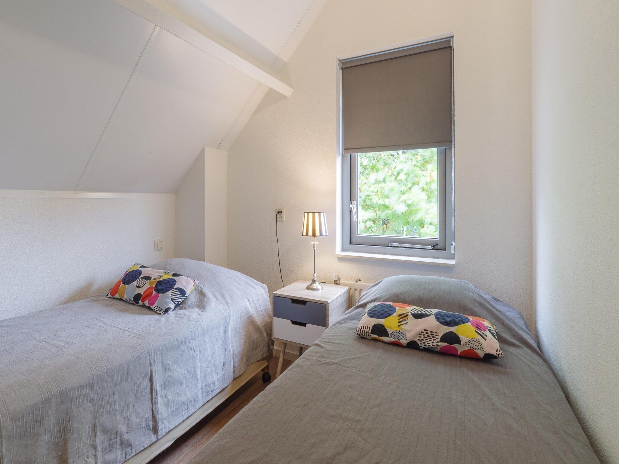 Een slaapkamer van Villapark De Oesterbaai 49 in Wemeldinge