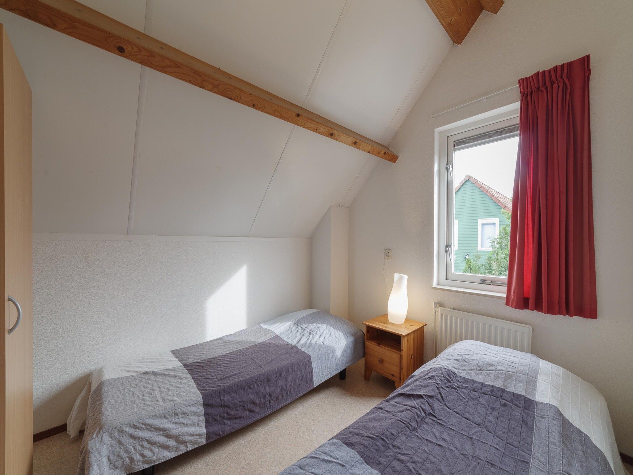 Een slaapkamer van Villapark De Oesterbaai 54 in Wemeldinge