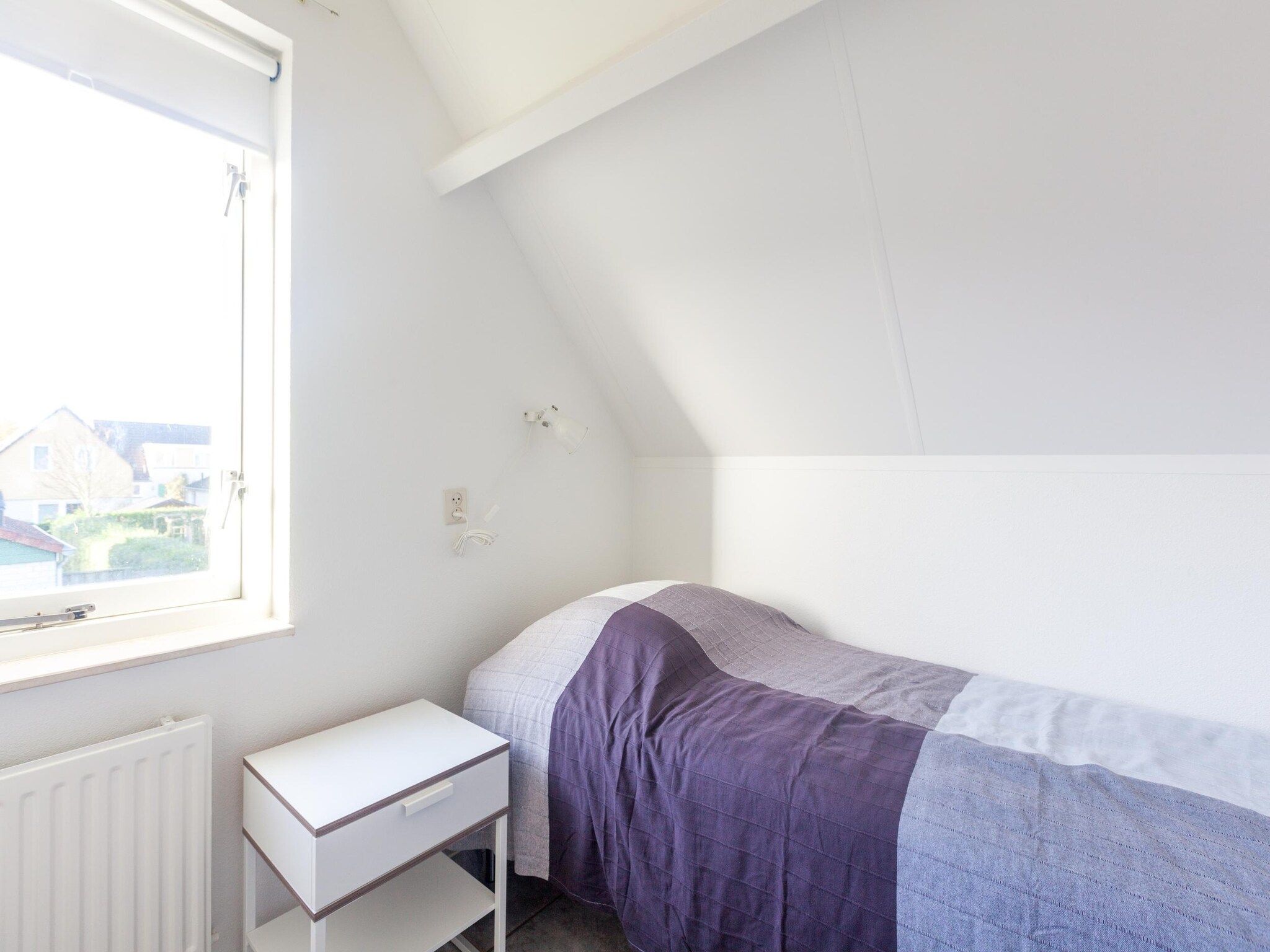 Een slaapkamer van Villapark De Oesterbaai 64 in Wemeldinge