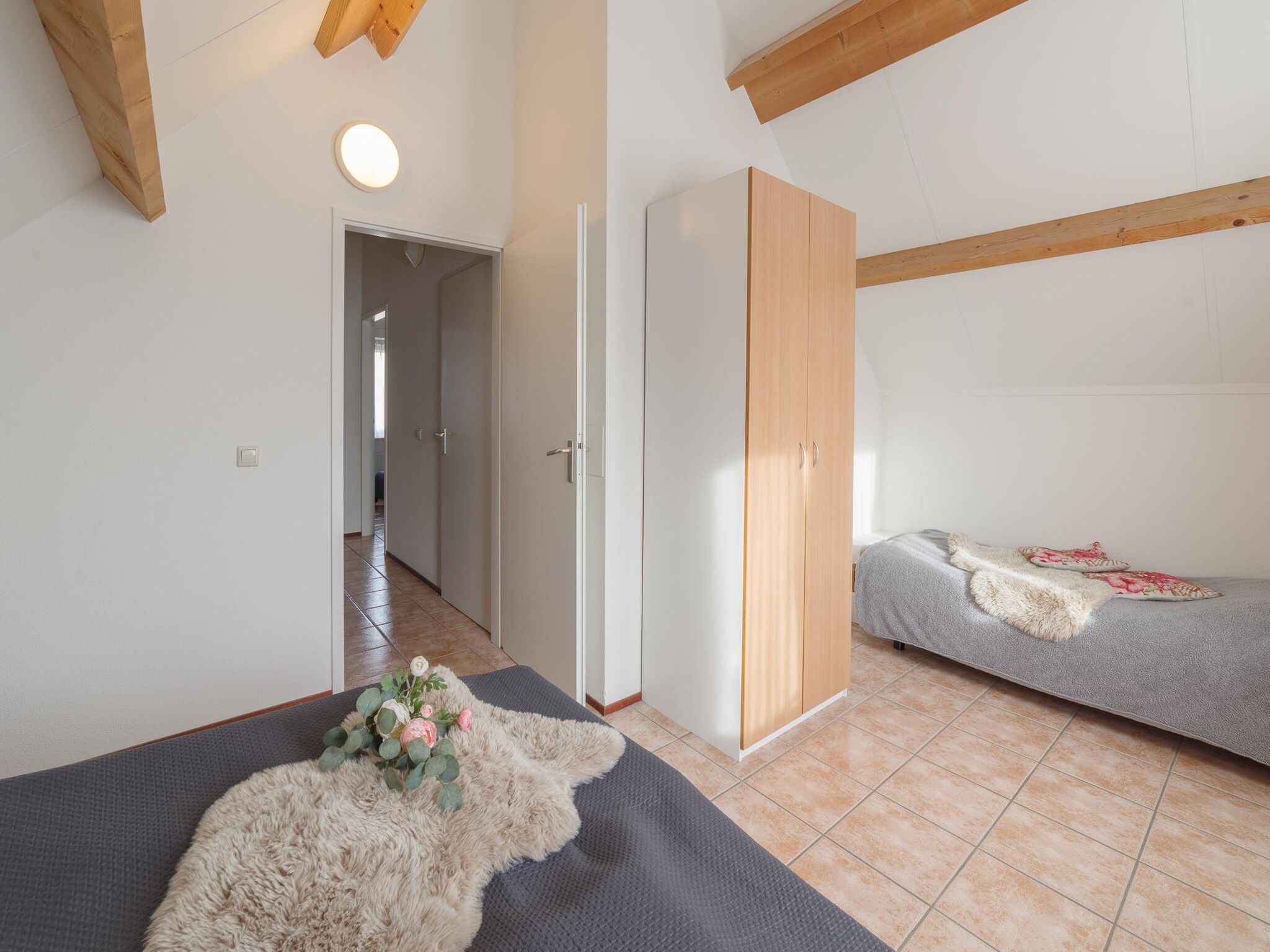 Een slaapkamer van Villapark De Oesterbaai 77 in Wemeldinge