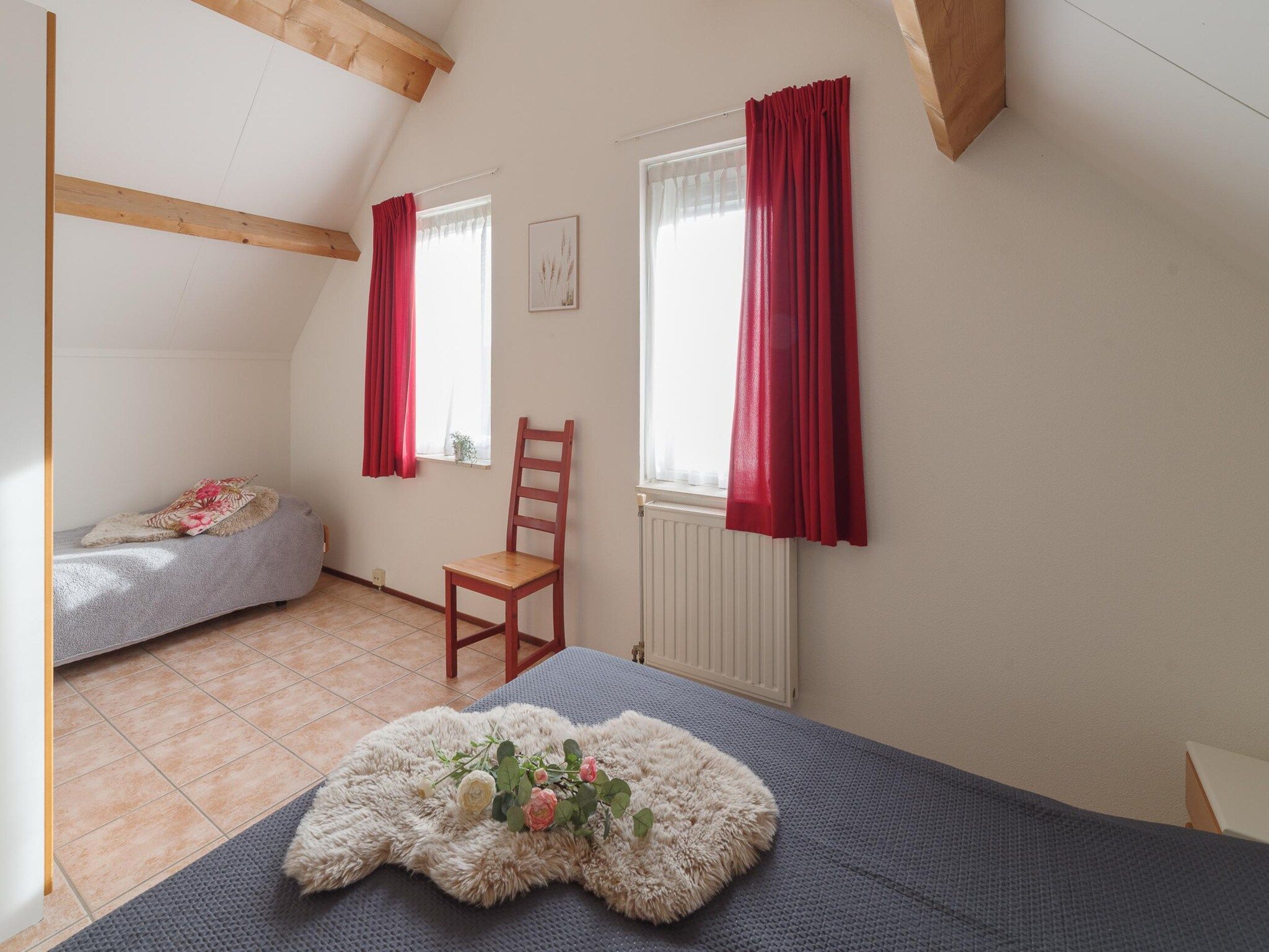 Een slaapkamer van Villapark De Oesterbaai 77 in Wemeldinge