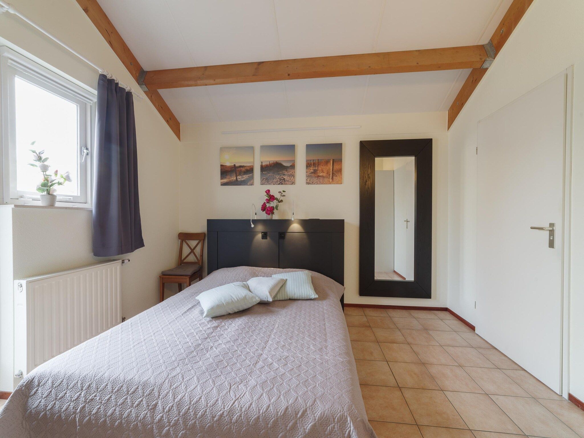 Een slaapkamer van Villapark De Oesterbaai 112 in Wemeldinge