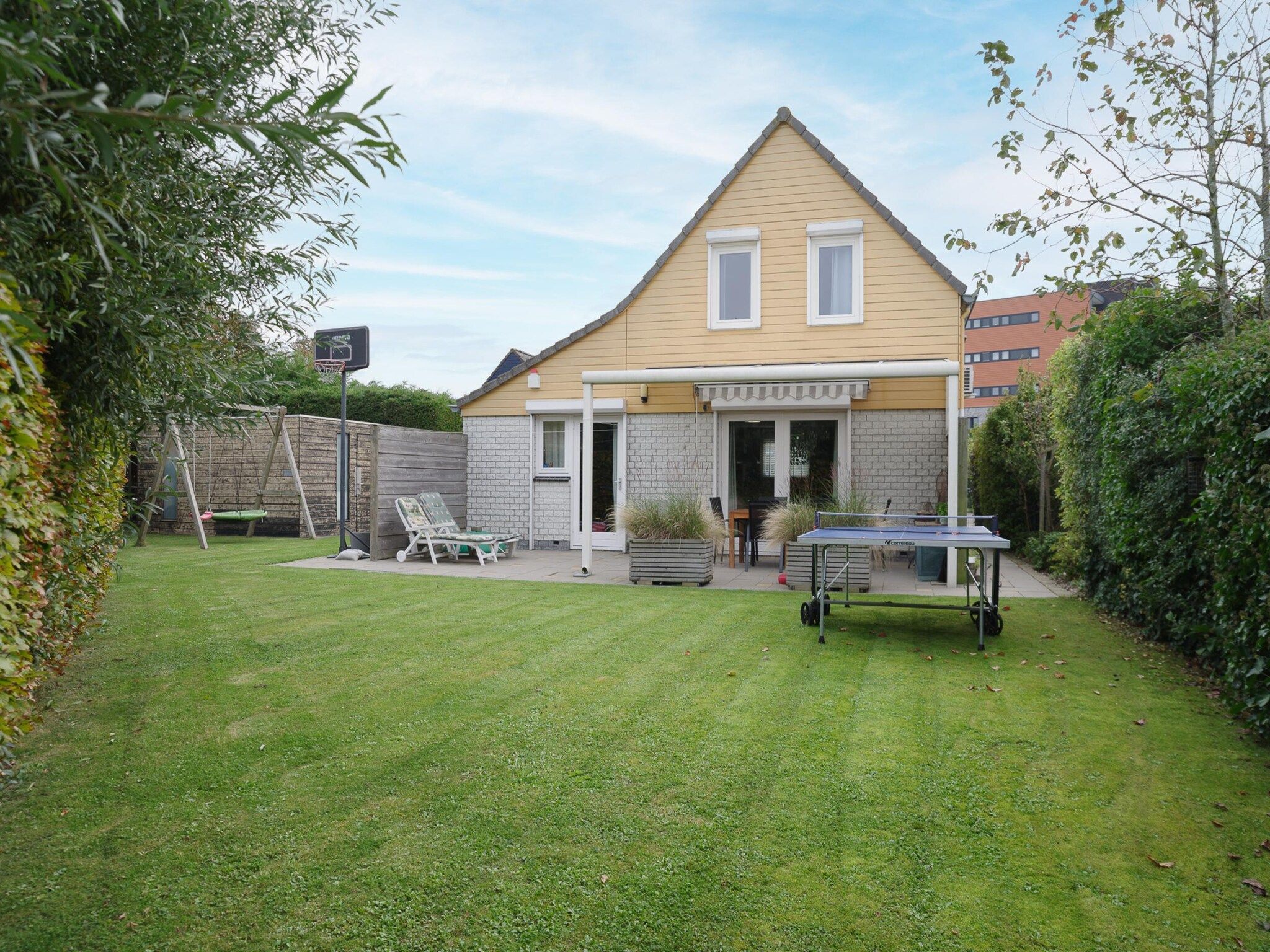 De tuin van Villapark De Oesterbaai 117 in Wemeldinge