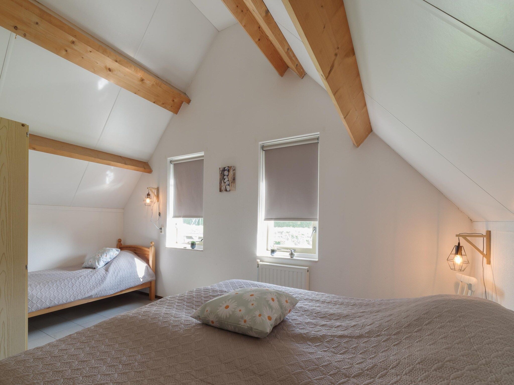 Een slaapkamer van Villapark De Oesterbaai 123 in Wemeldinge