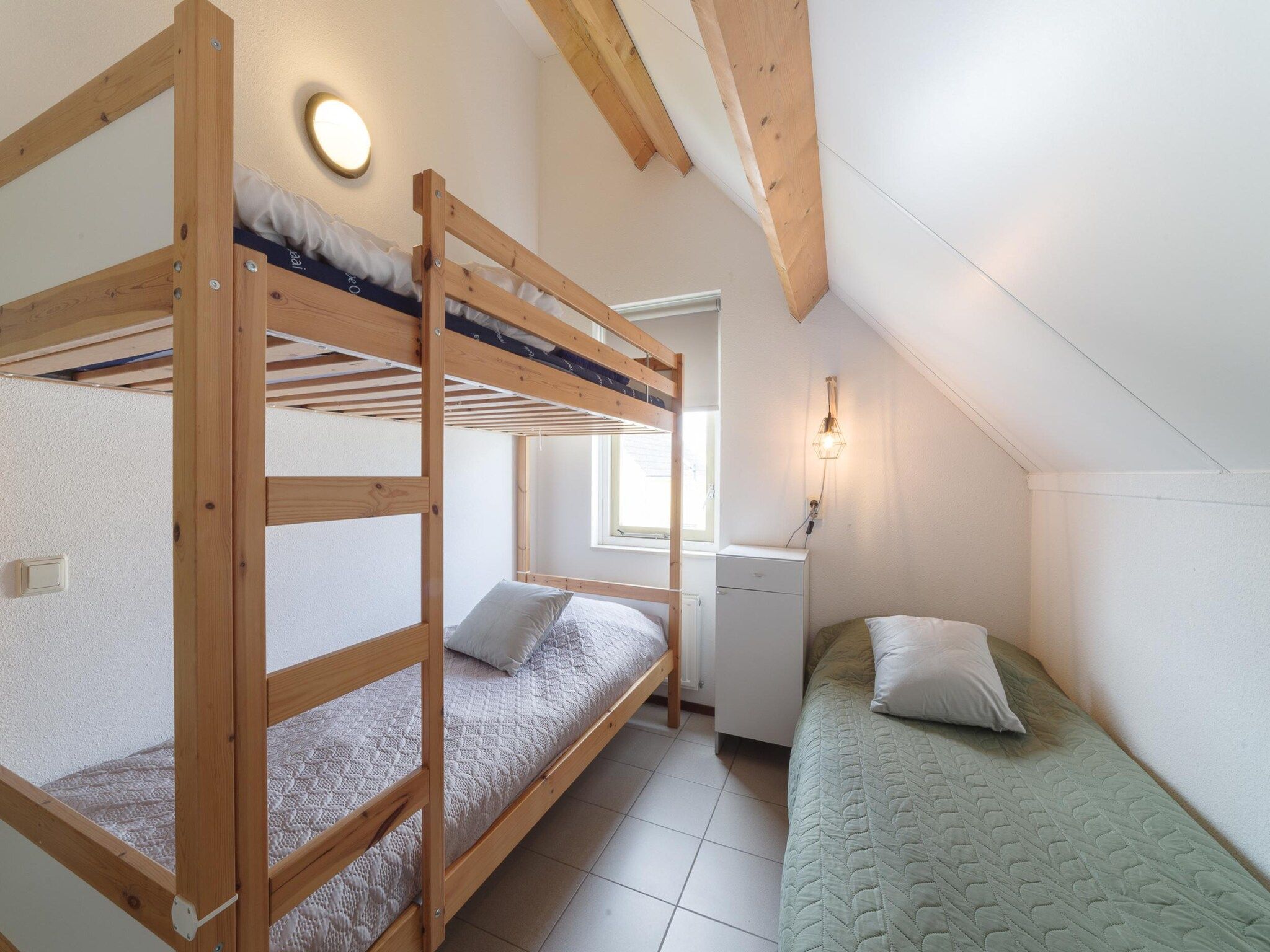 Een slaapkamer van Villapark De Oesterbaai 123 in Wemeldinge