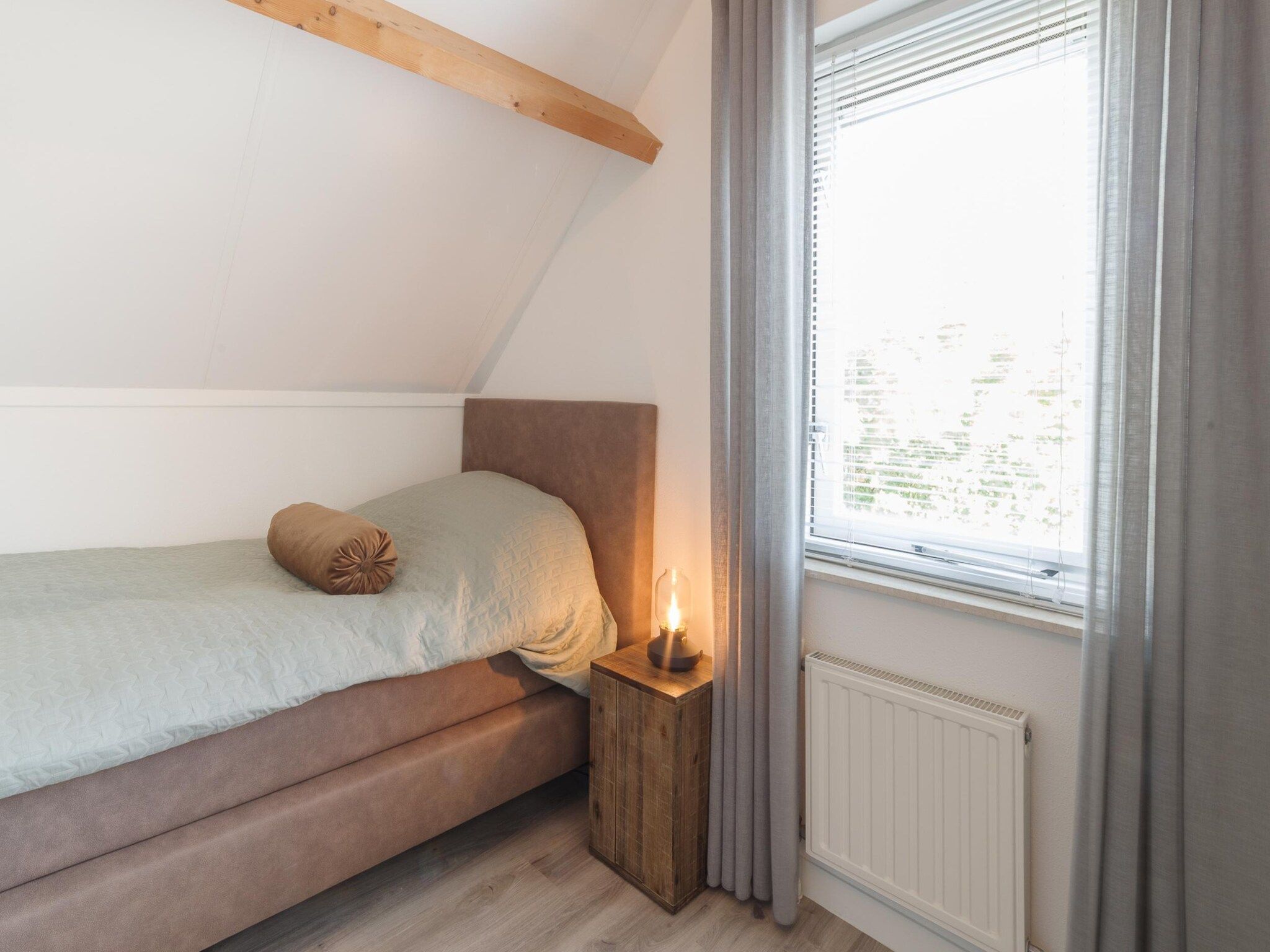 Een slaapkamer van Villapark De Oesterbaai 126 in Wemeldinge