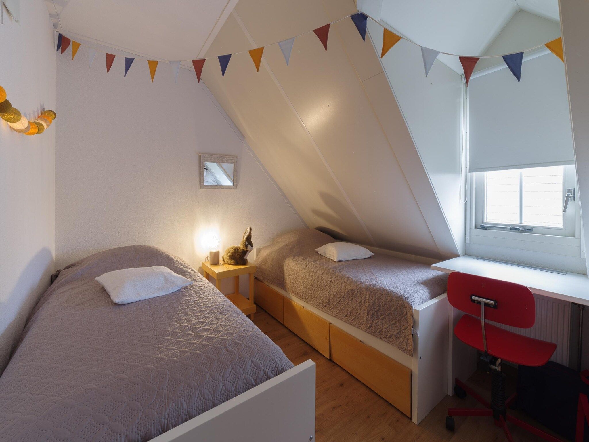 Een slaapkamer van Villapark De Oesterbaai 136 in Wemeldinge