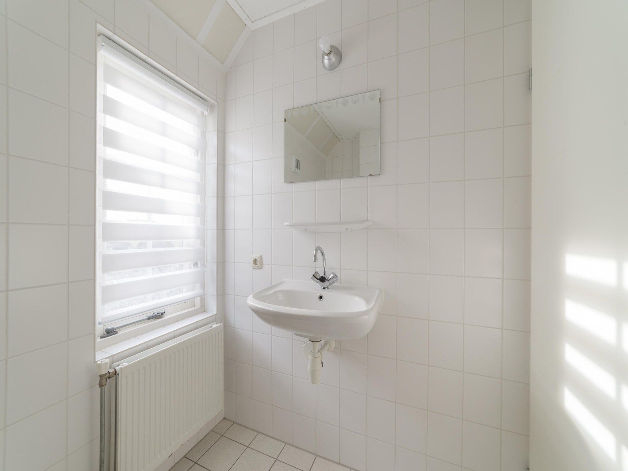 De badkamer van Villapark De Oesterbaai 142 in Wemeldinge